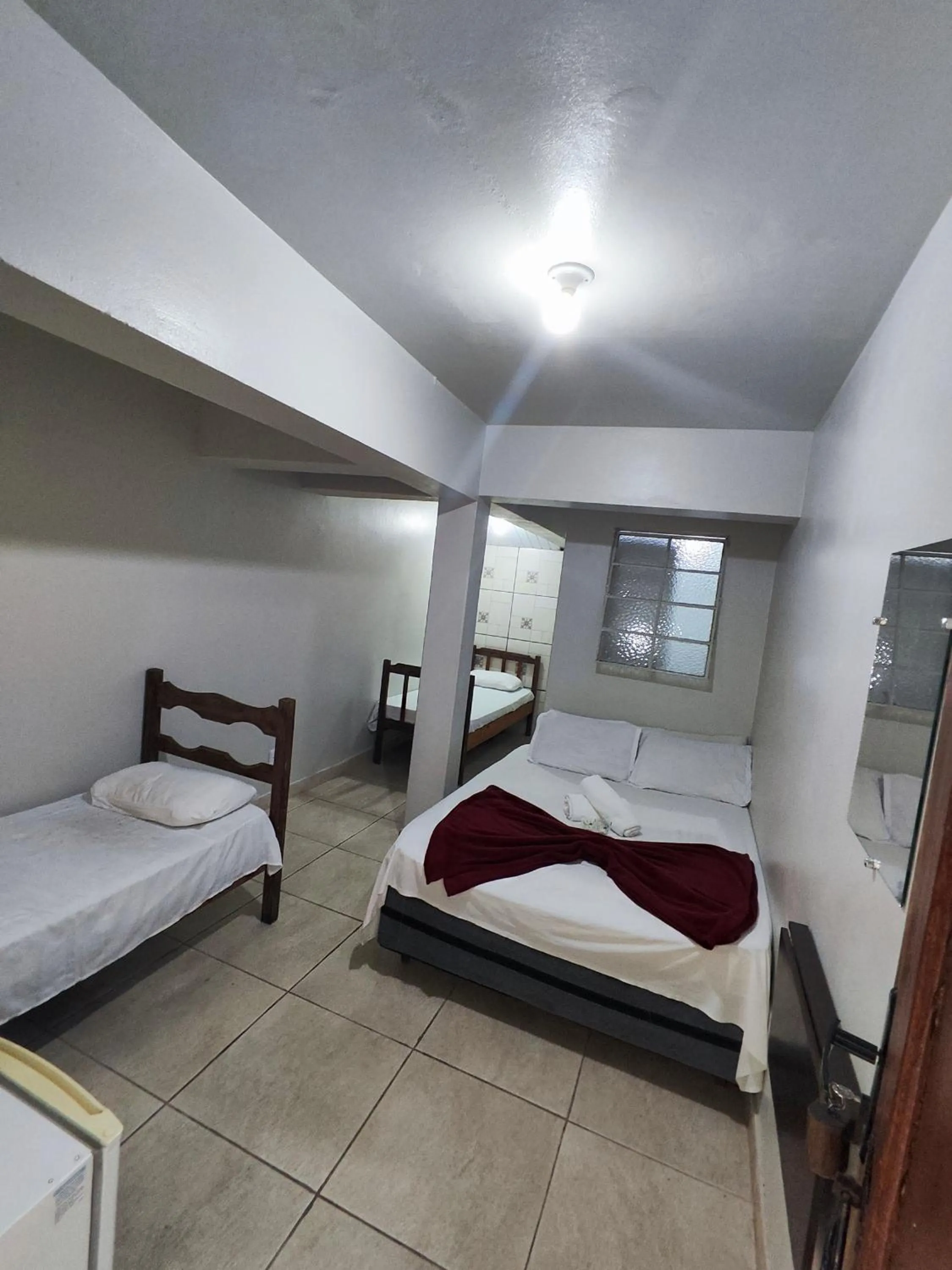 Bed in Pousada Acayaca