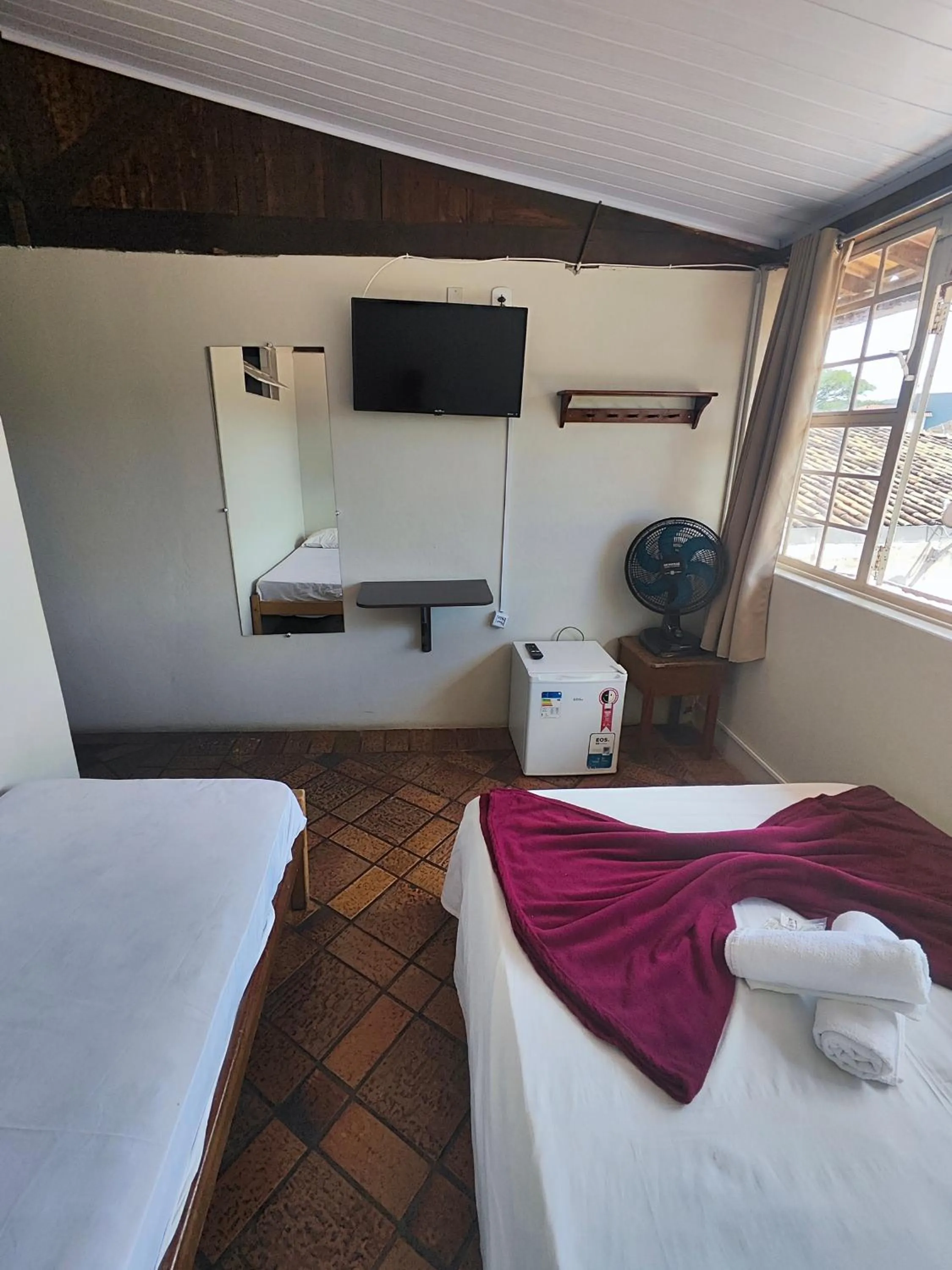 Bed in Pousada Acayaca