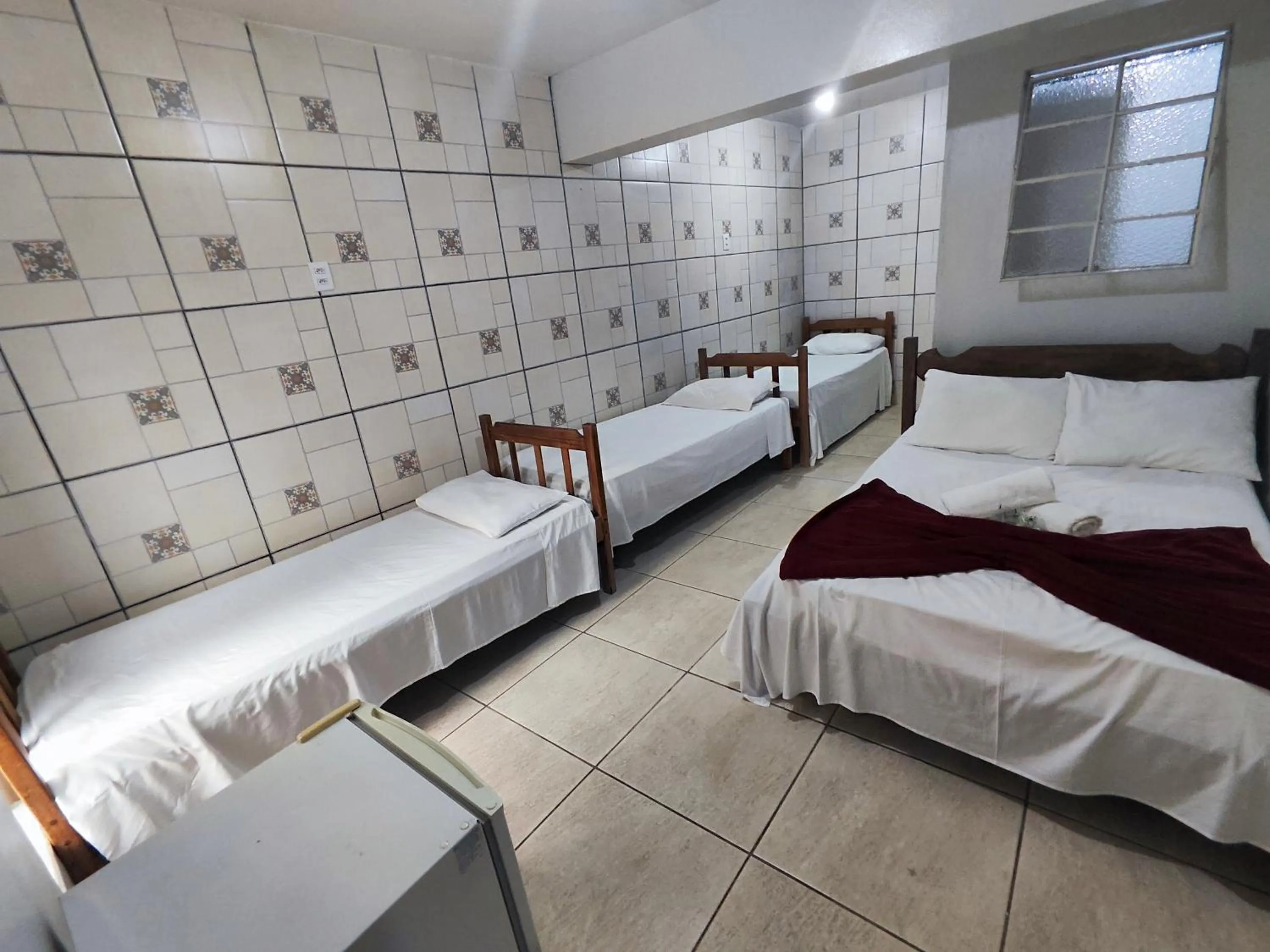 Bed in Pousada Acayaca