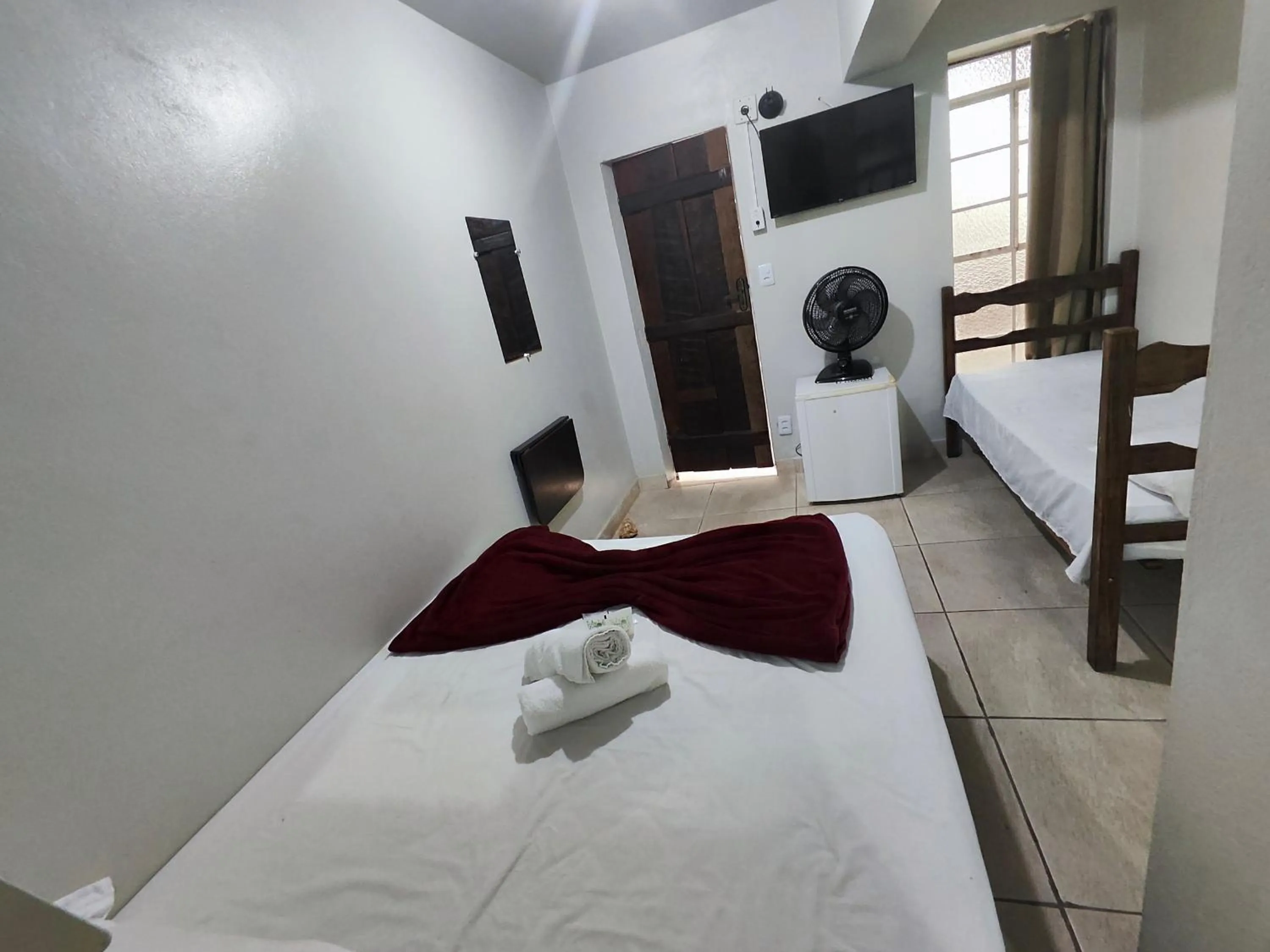 Bed in Pousada Acayaca