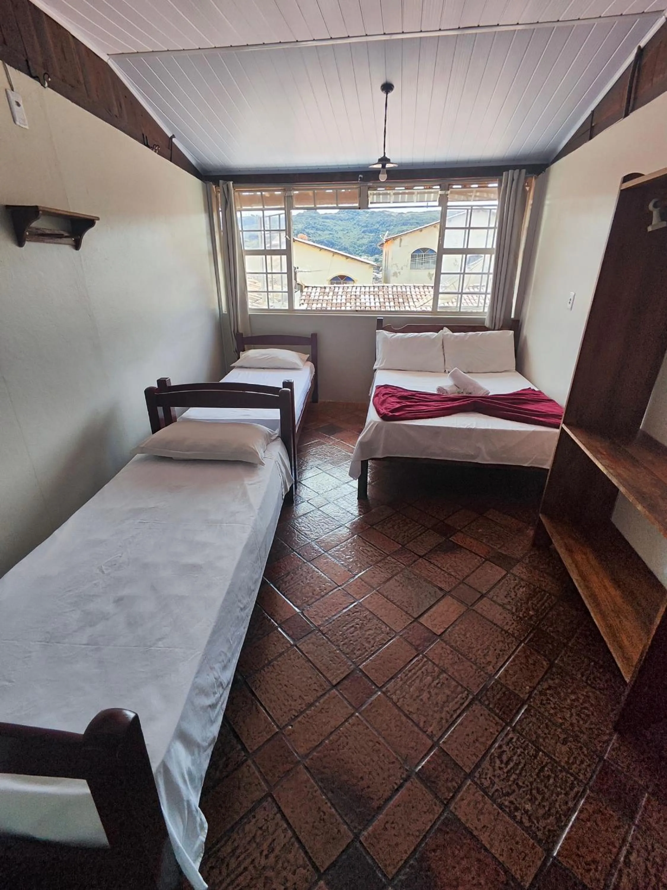 Bed in Pousada Acayaca