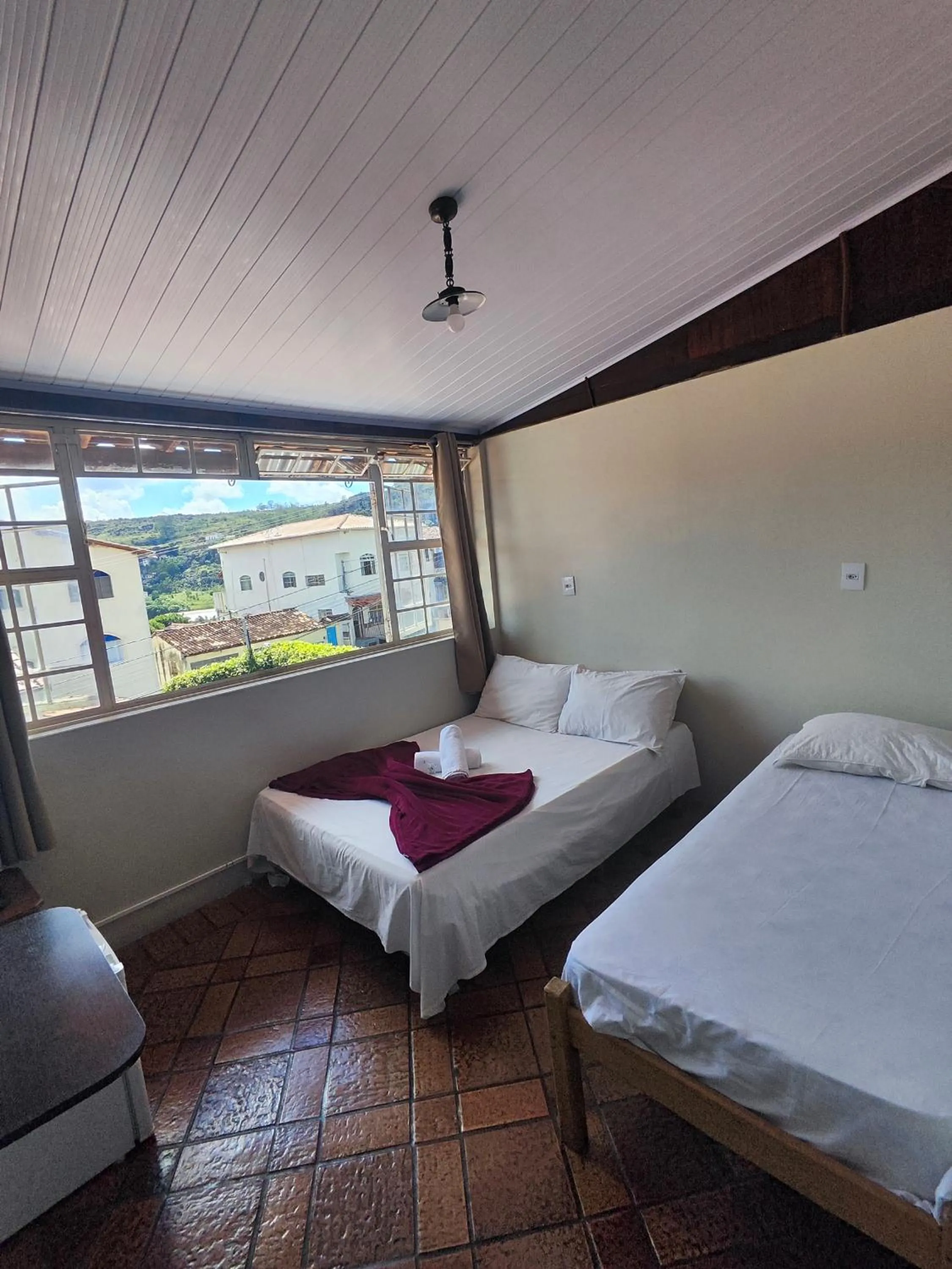 Bed in Pousada Acayaca