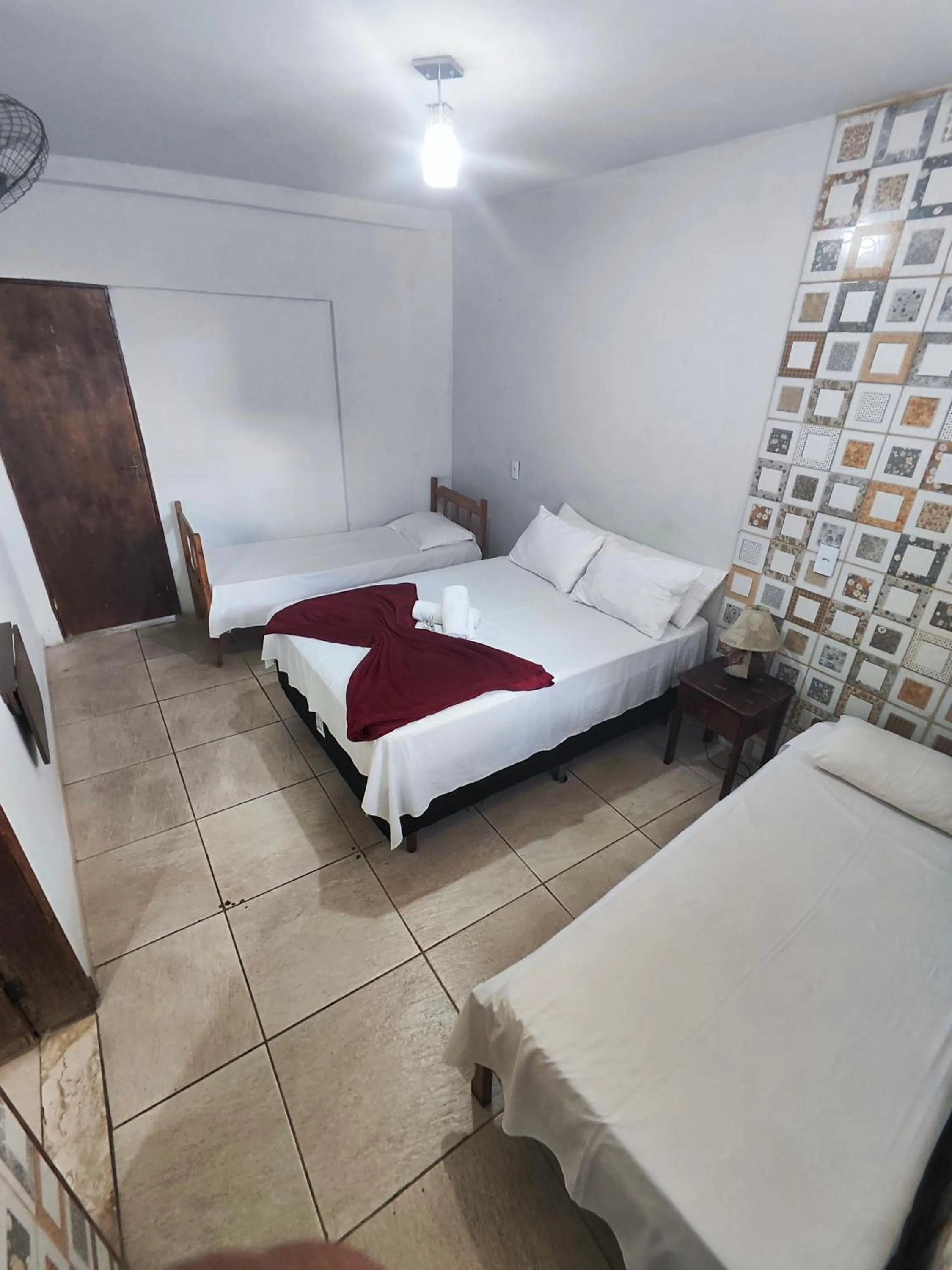 Bed in Pousada Acayaca