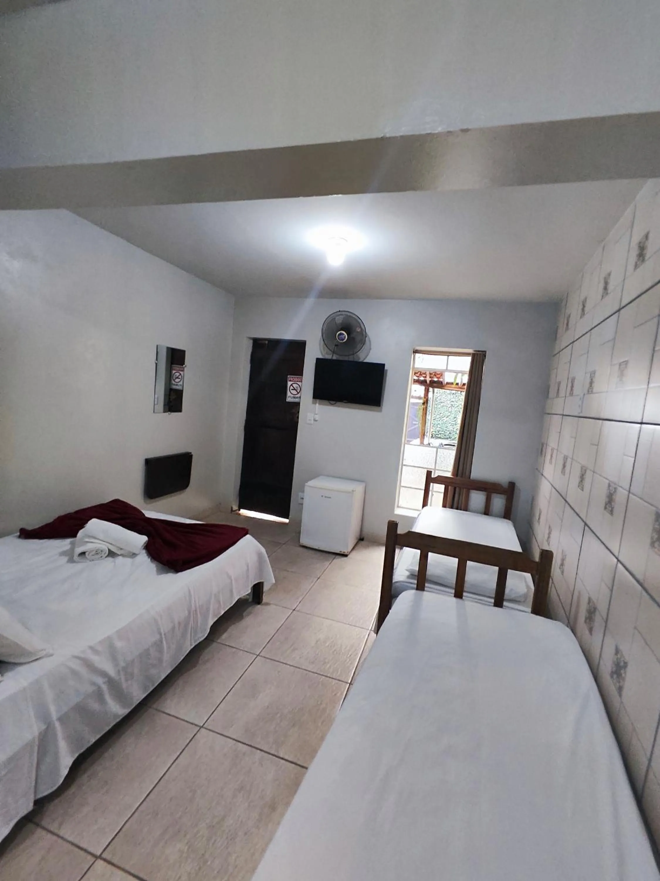 Bed in Pousada Acayaca