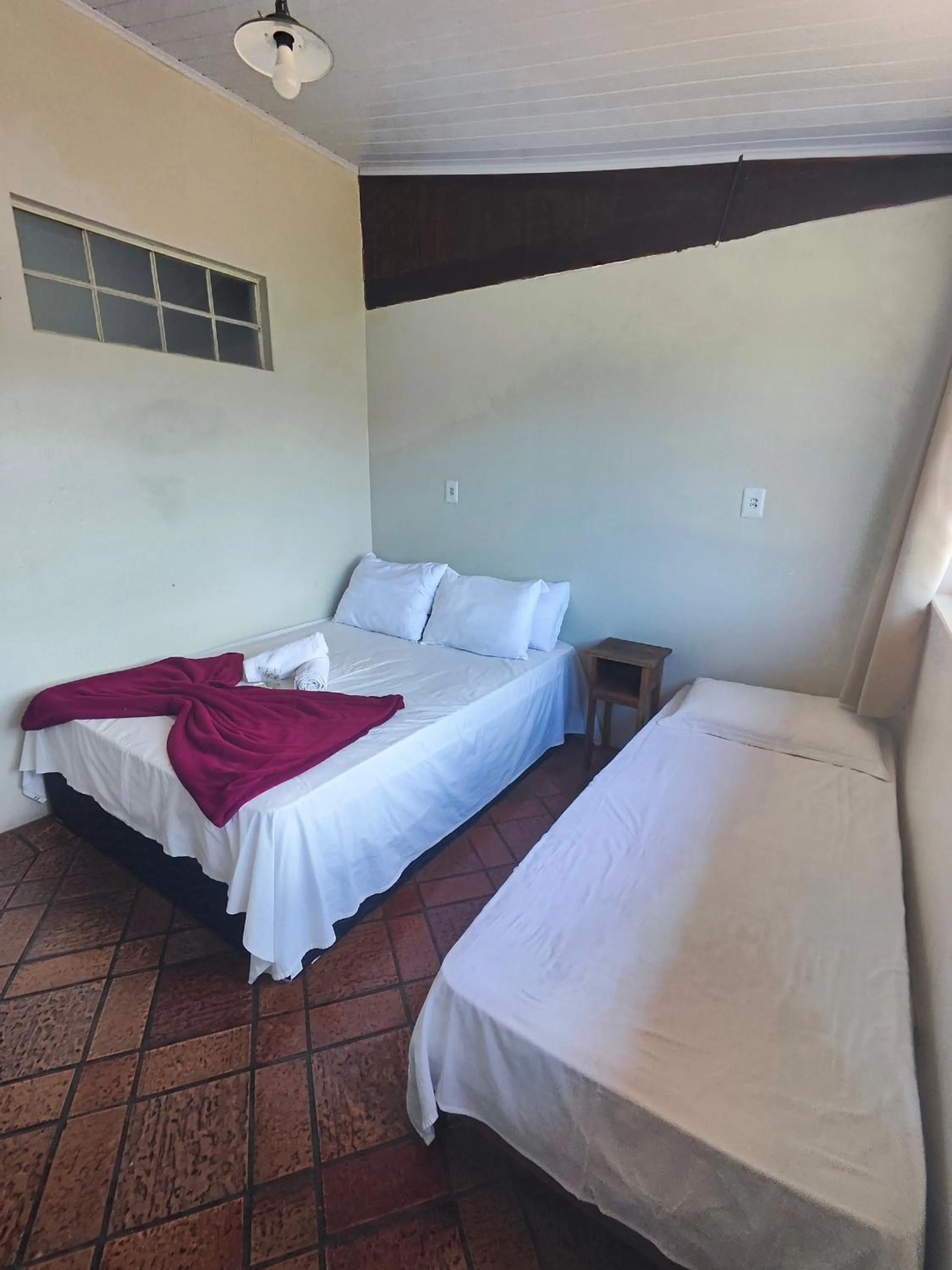 Bed in Pousada Acayaca