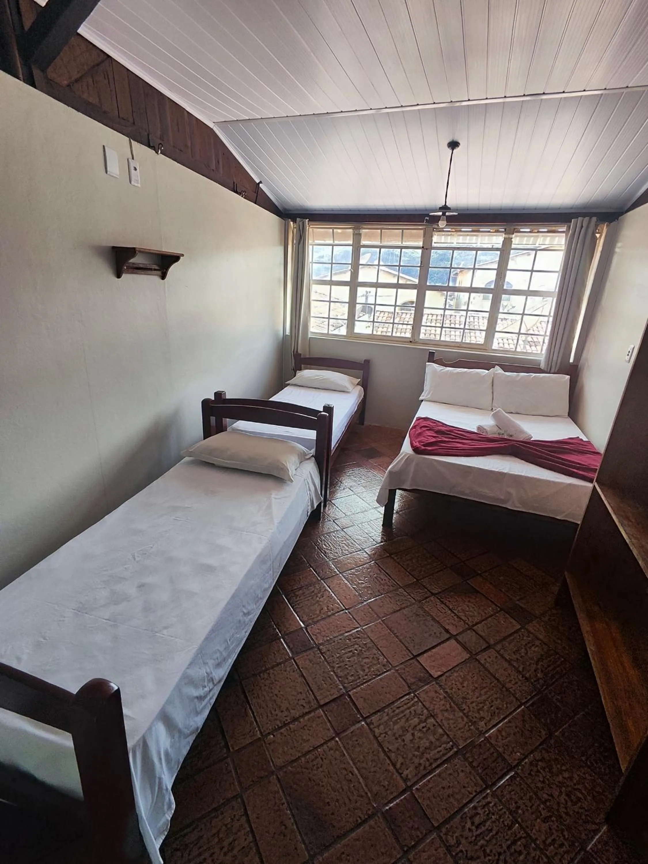 Bed in Pousada Acayaca