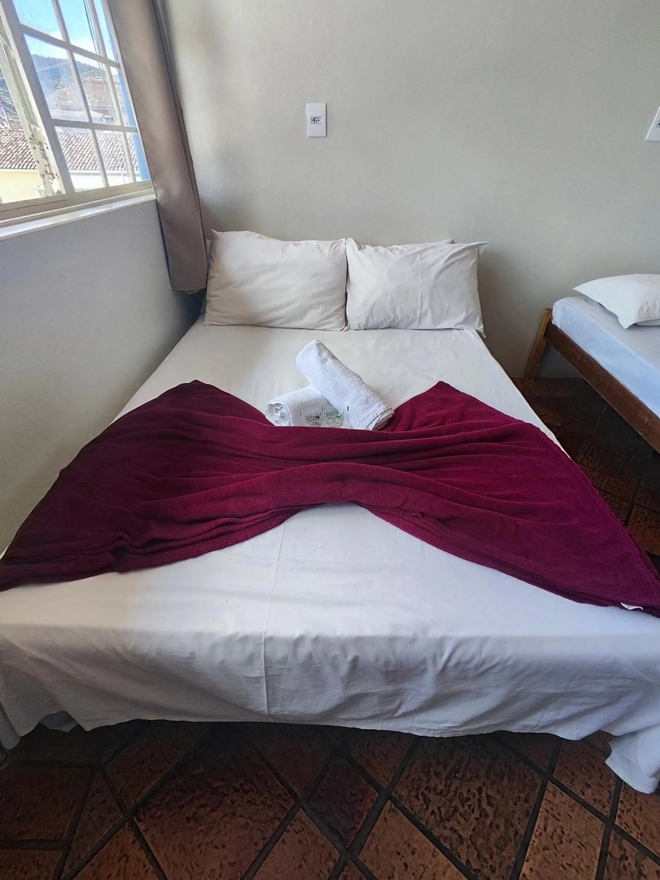 Bed in Pousada Acayaca