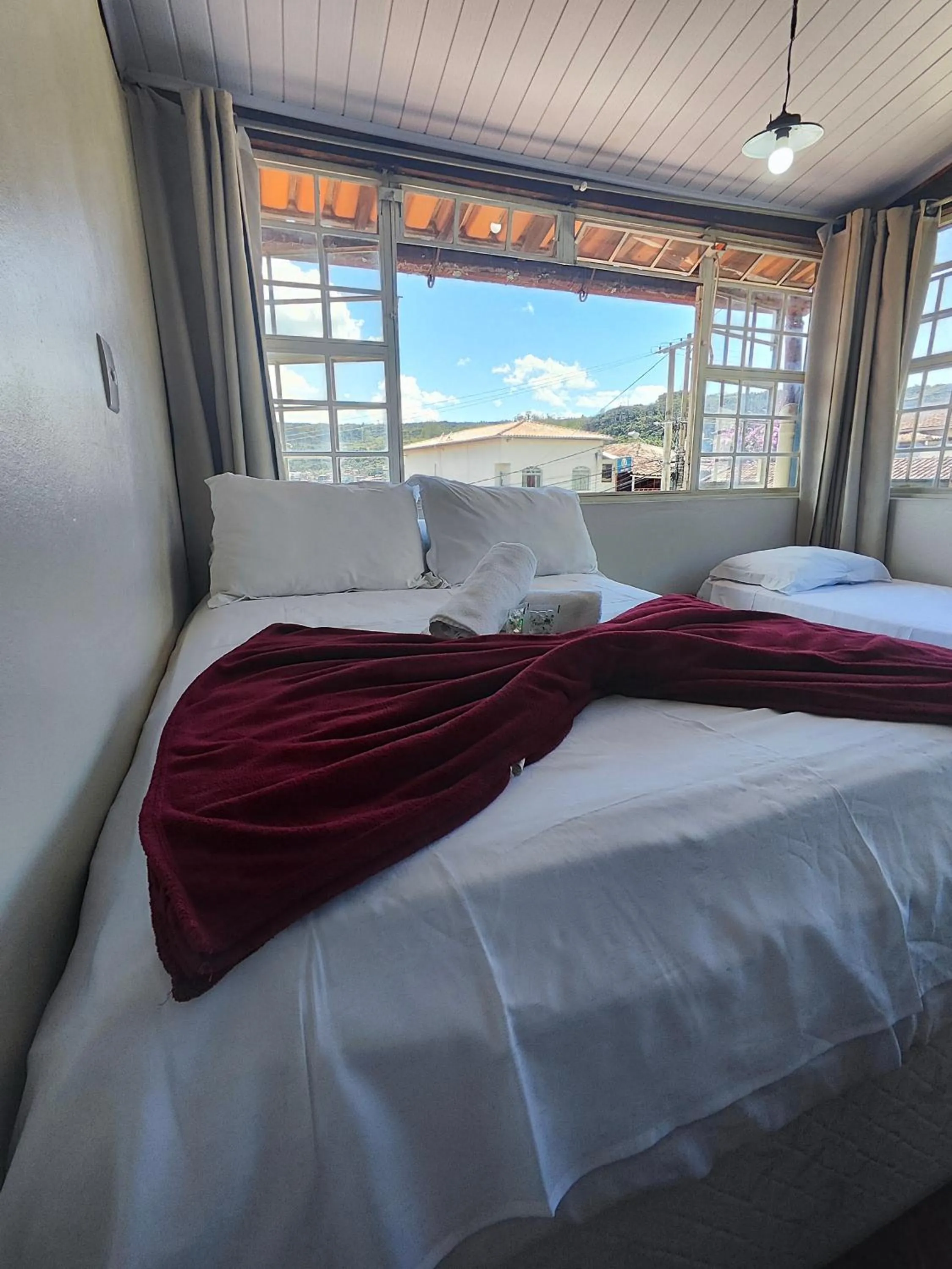 Bed in Pousada Acayaca