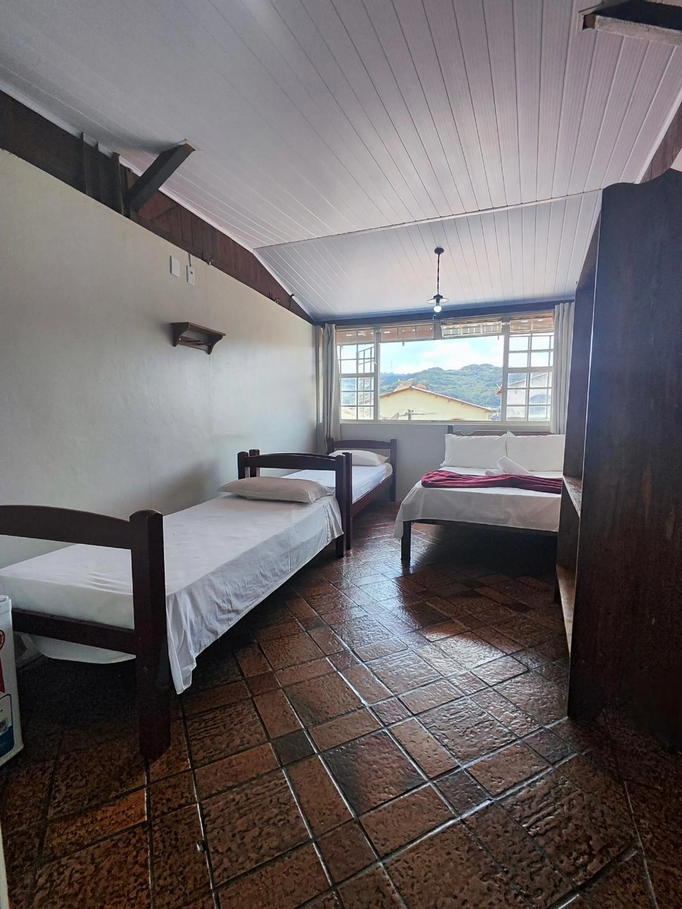 Bed in Pousada Acayaca