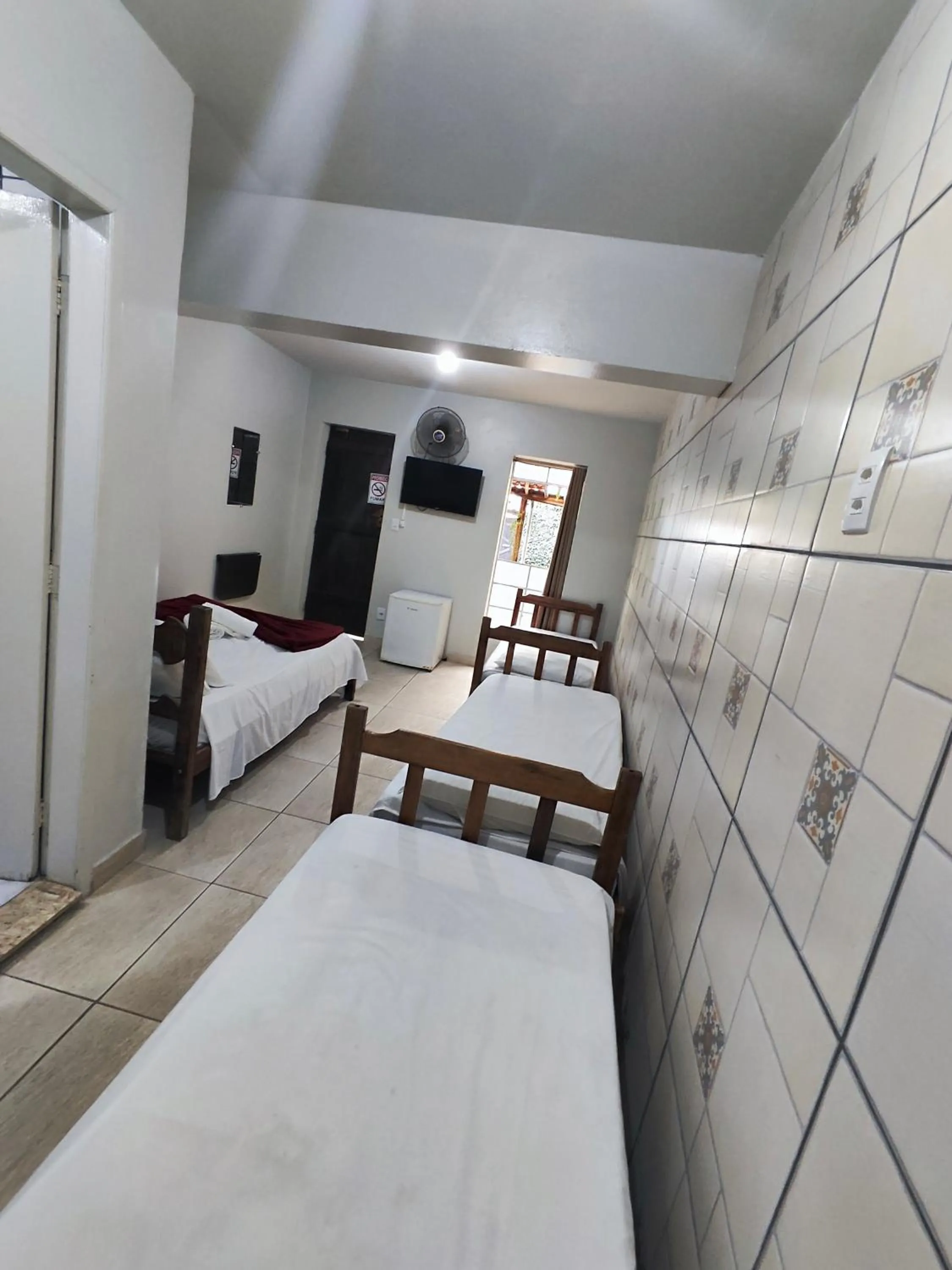 Bed in Pousada Acayaca