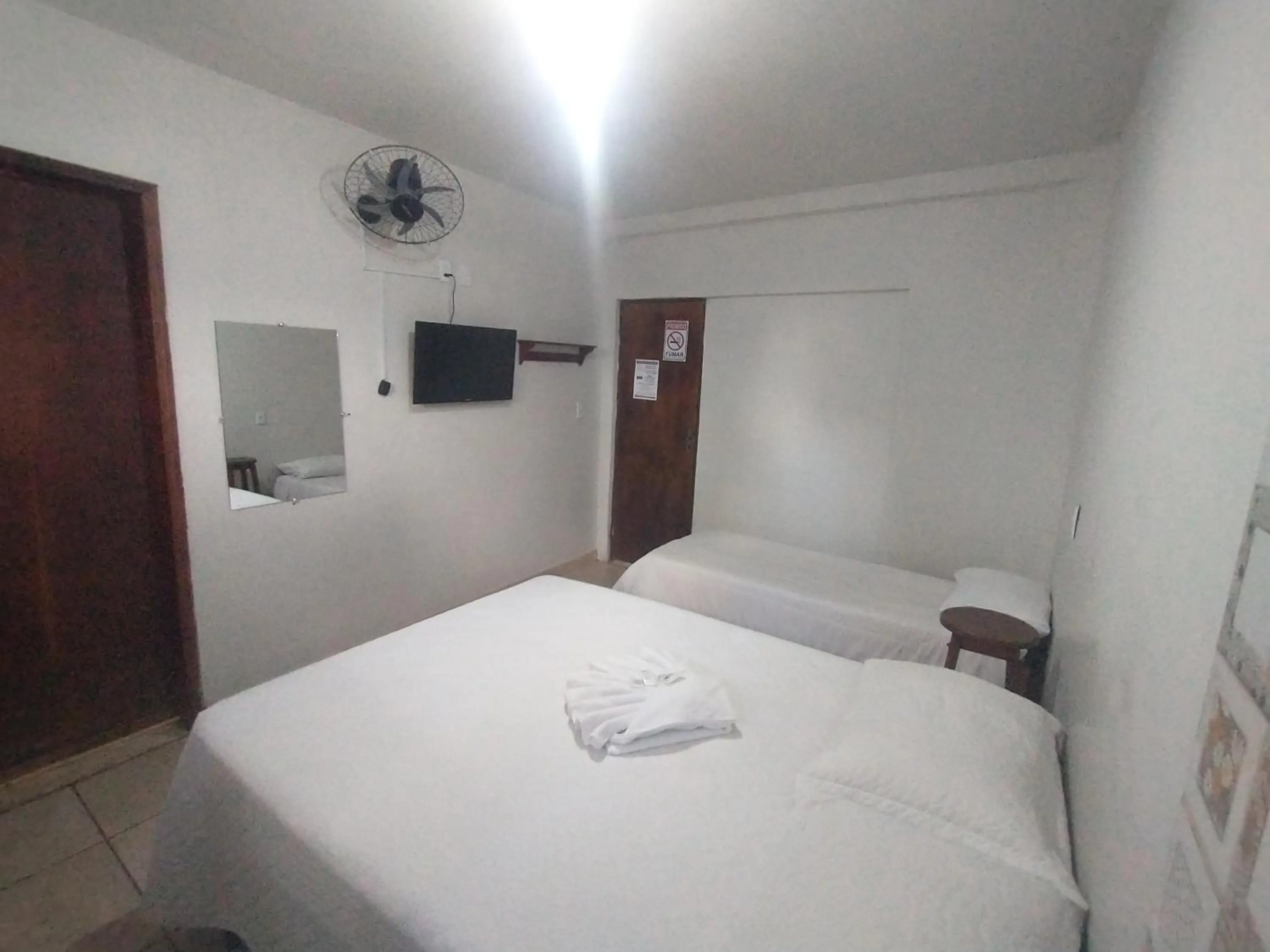 Bed in Pousada Acayaca