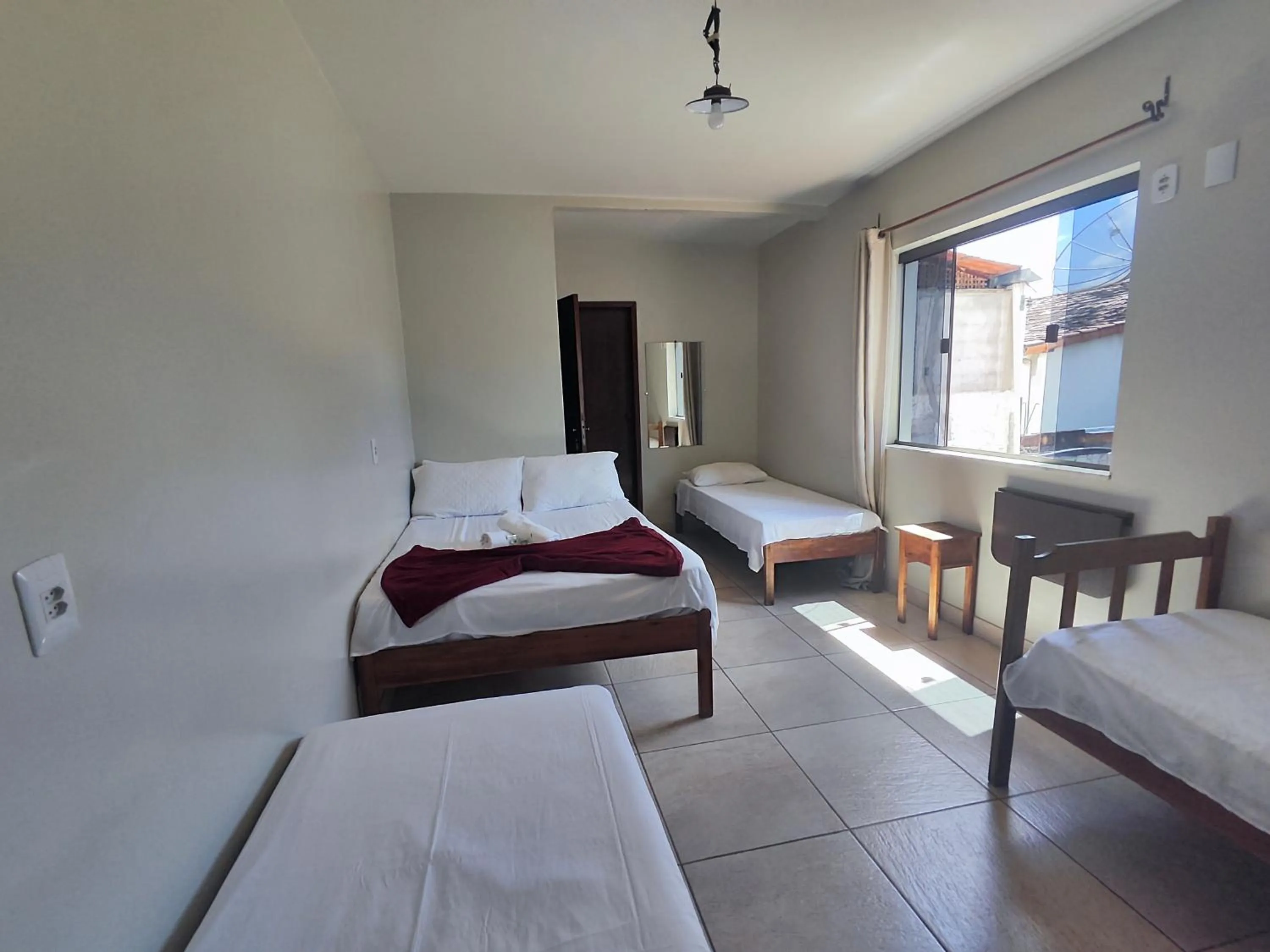 Bed in Pousada Acayaca