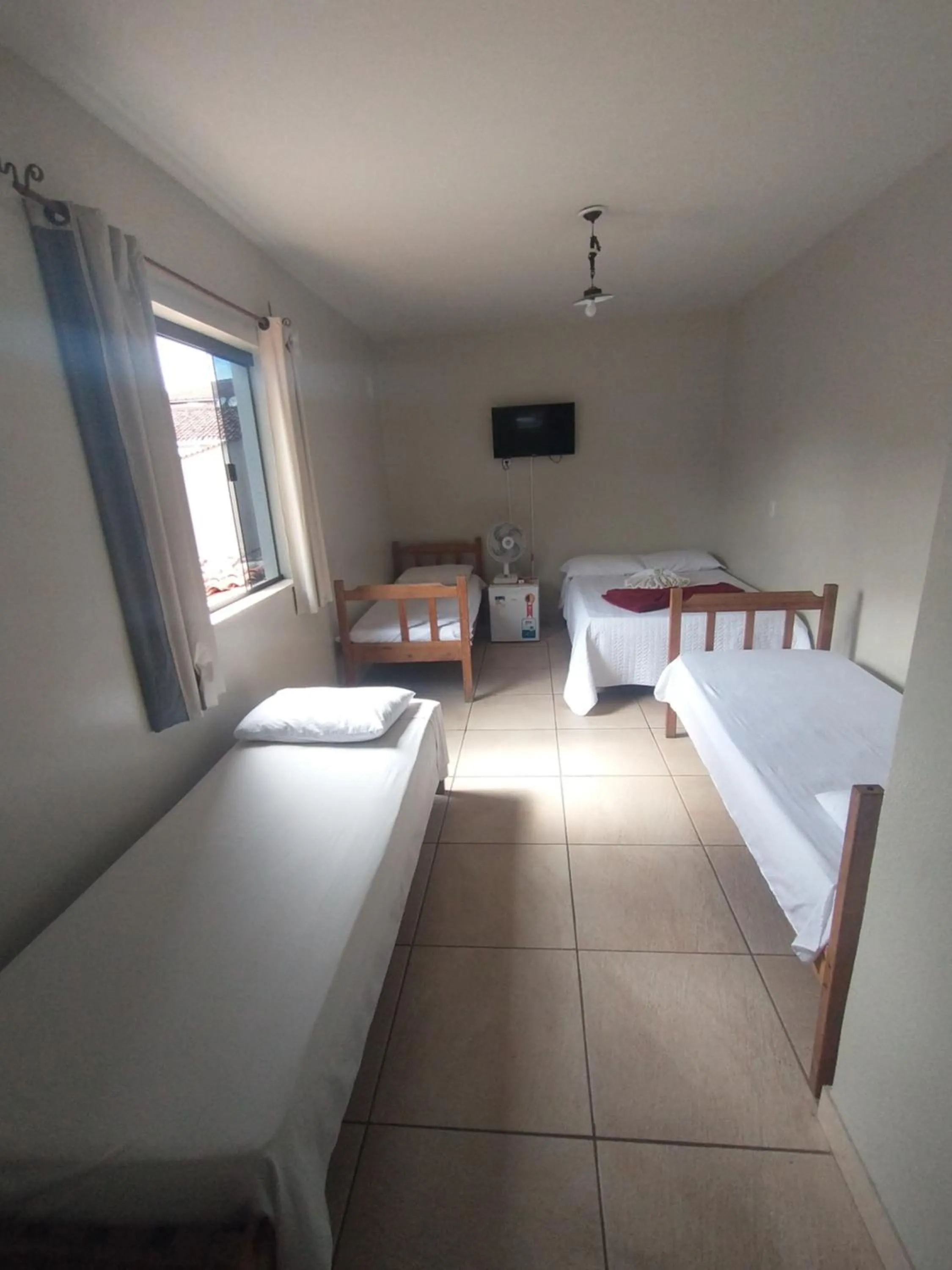 Bed in Pousada Acayaca