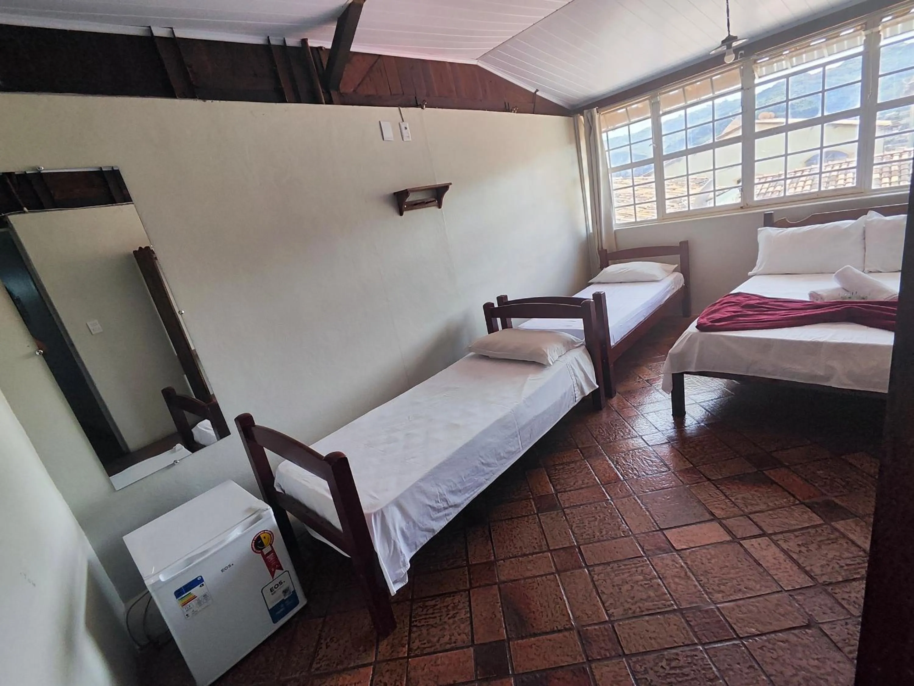 Bed in Pousada Acayaca