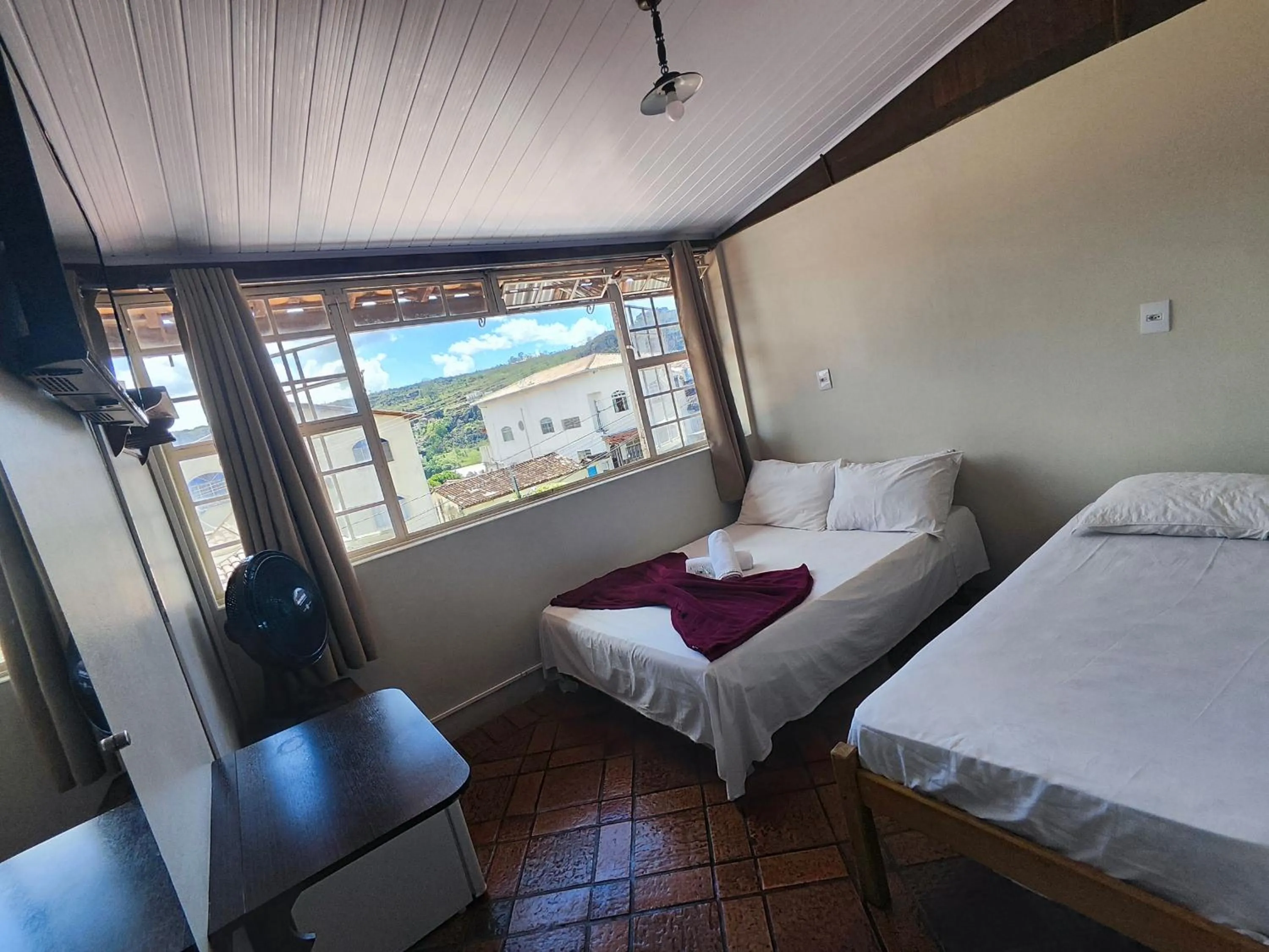 Bed in Pousada Acayaca