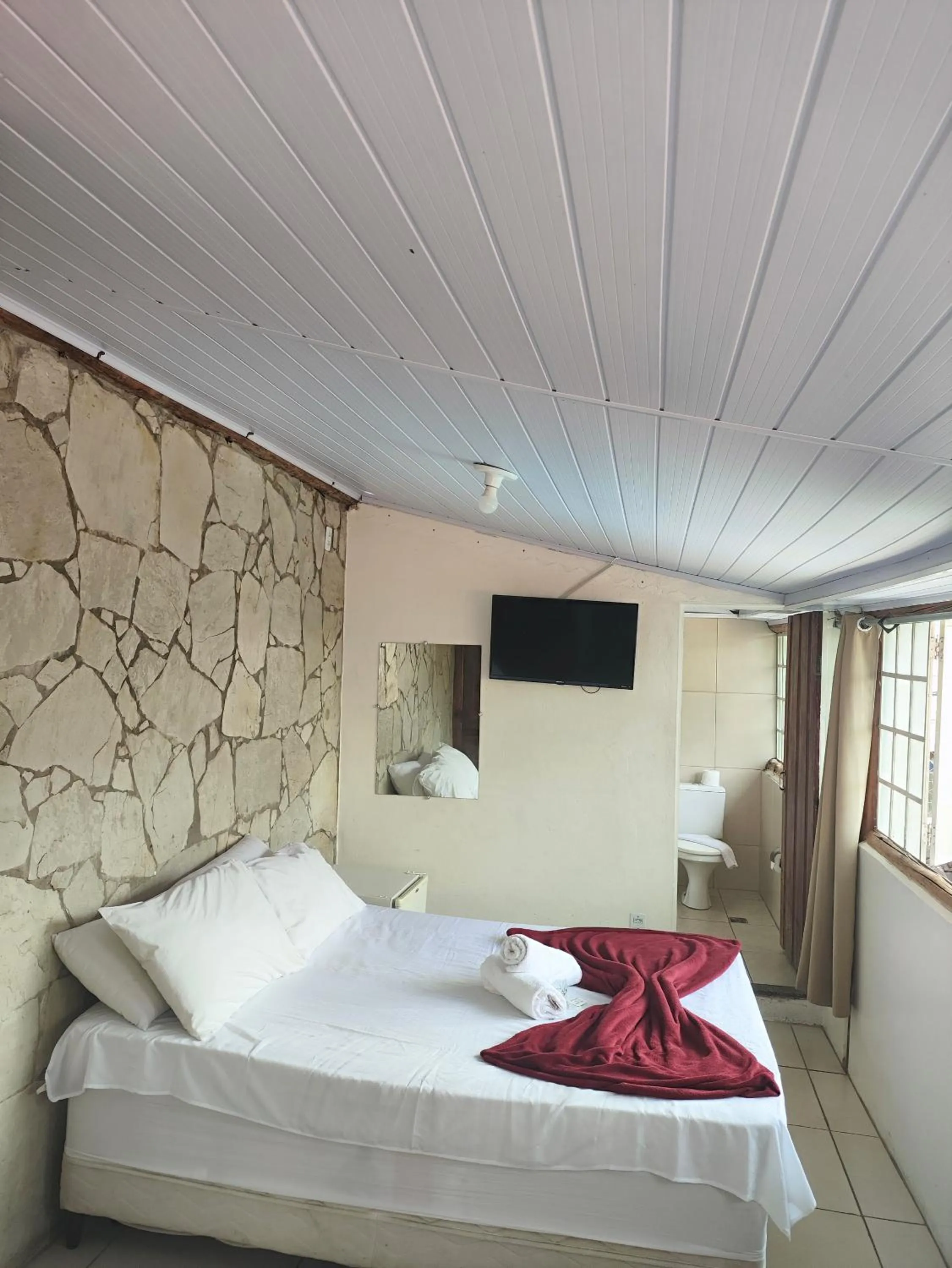 Bed in Pousada Acayaca