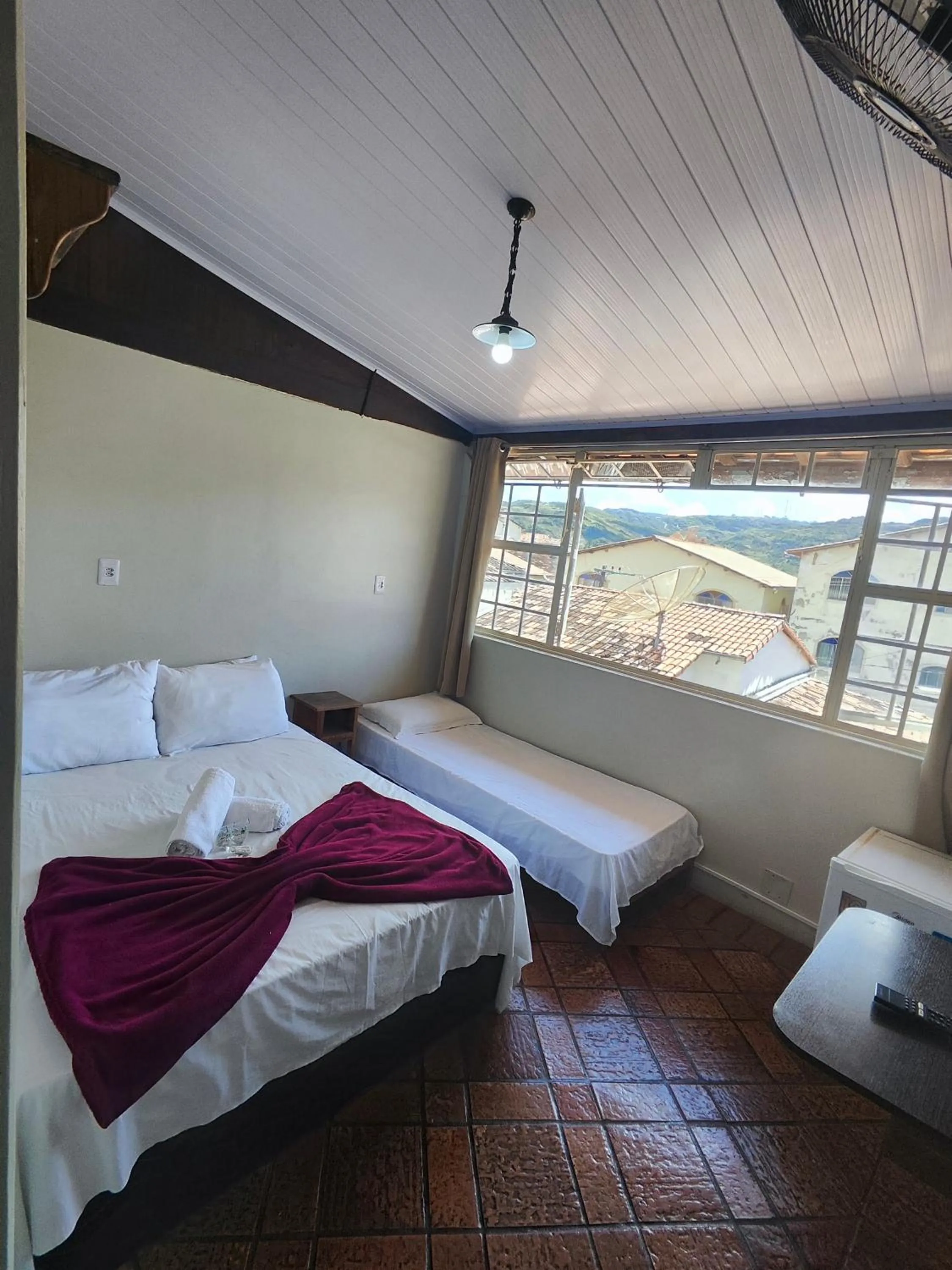 Bed in Pousada Acayaca