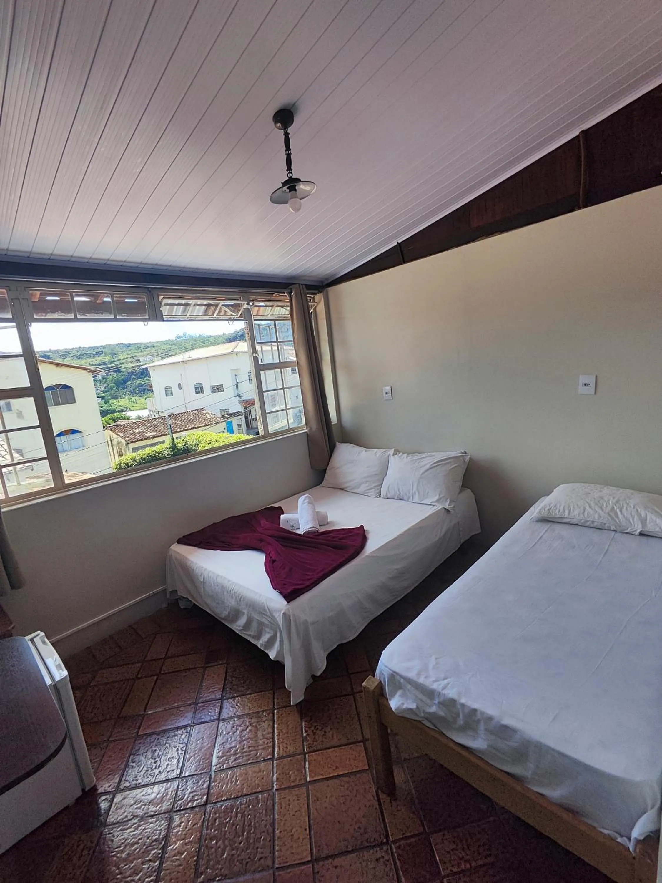 Bed in Pousada Acayaca