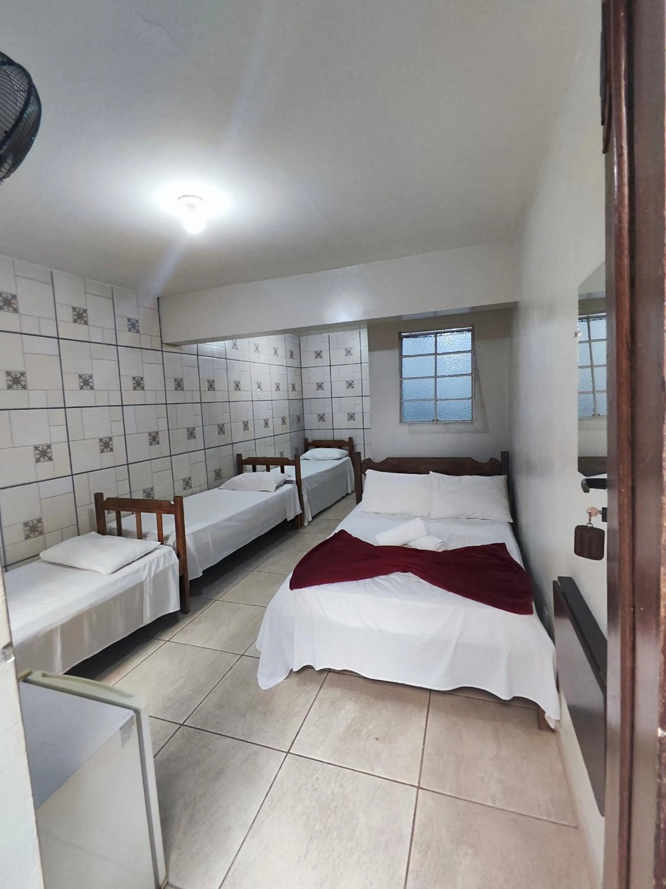 Bed in Pousada Acayaca