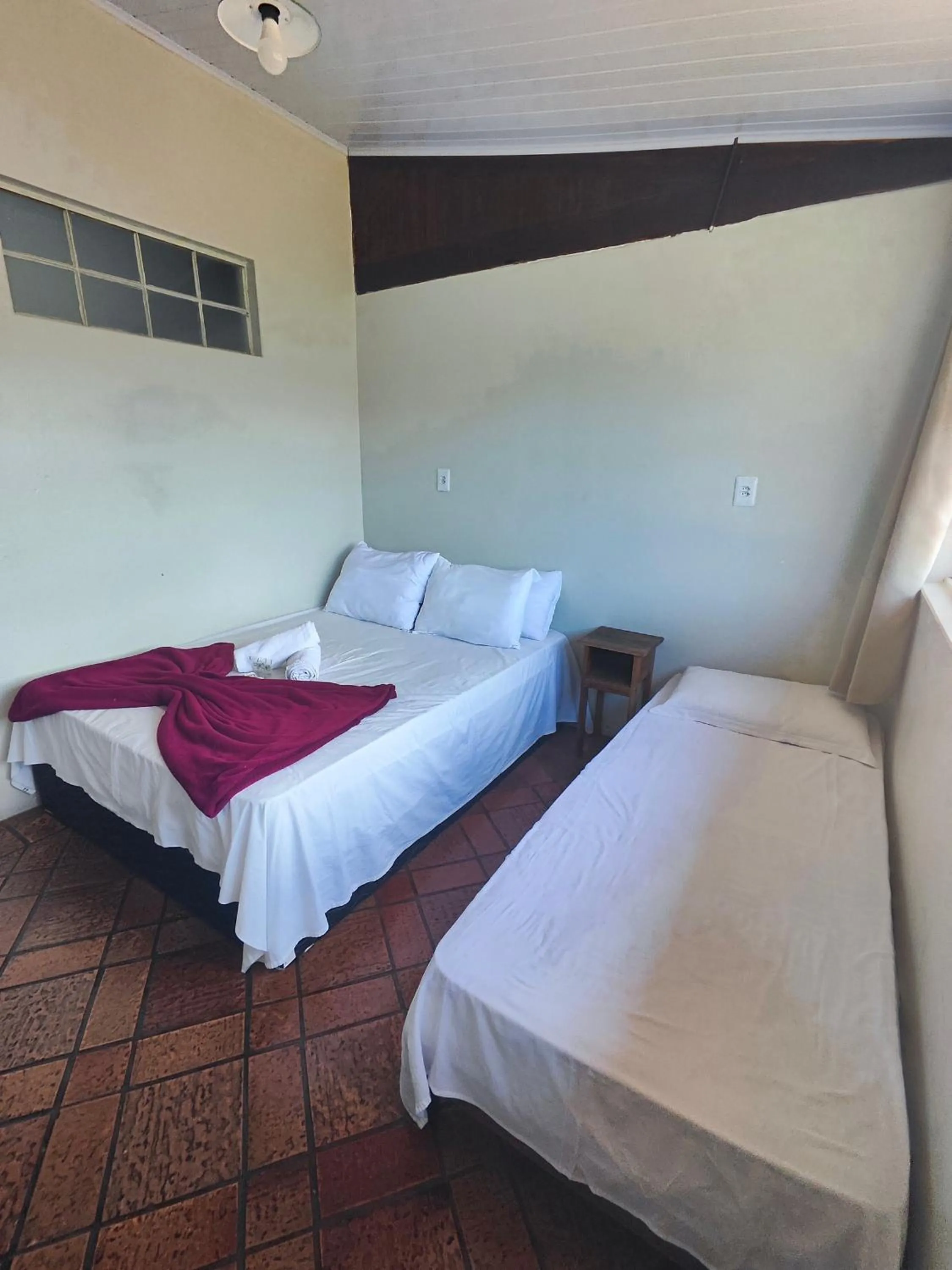 Bed in Pousada Acayaca
