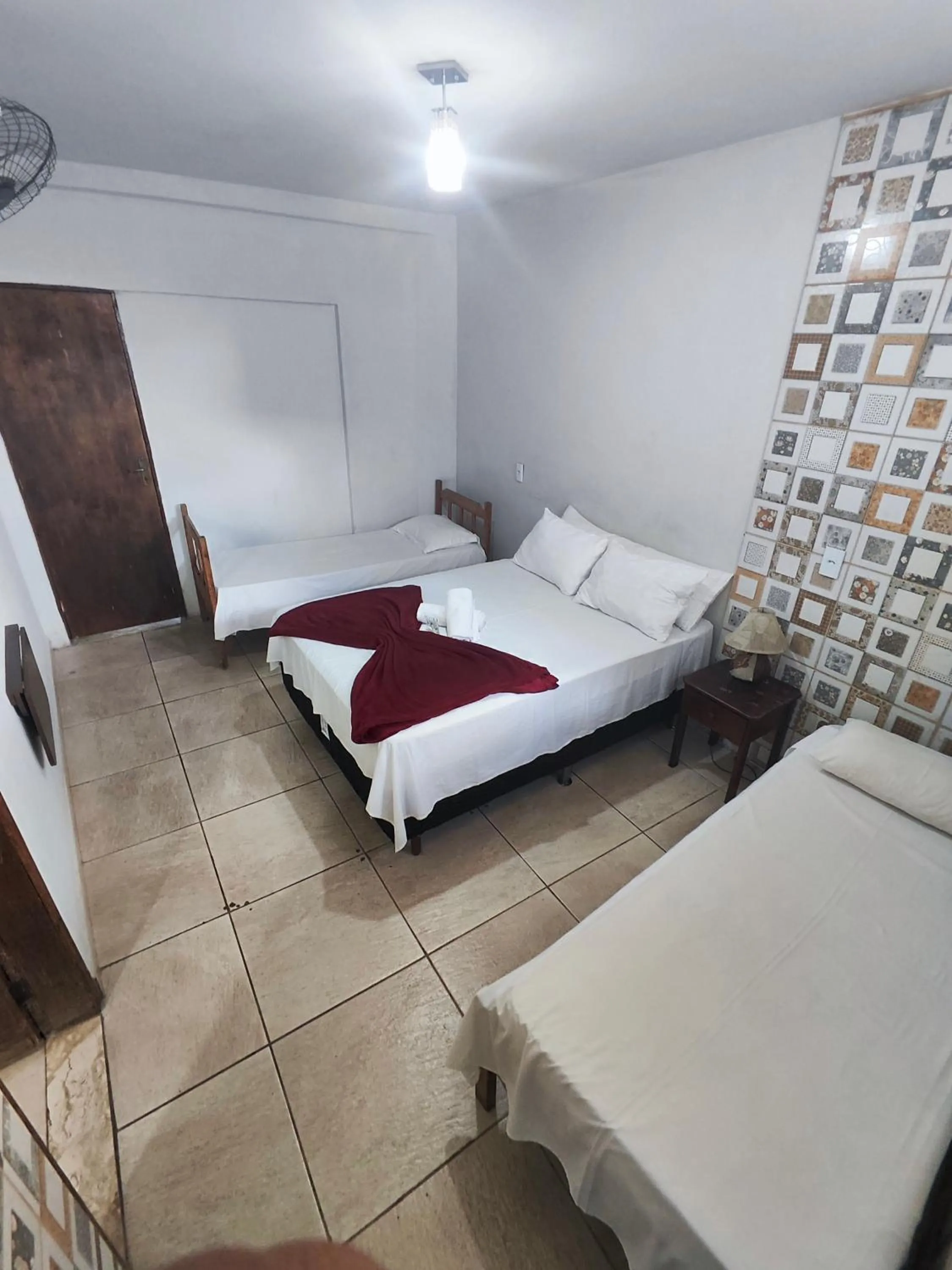 Bed in Pousada Acayaca