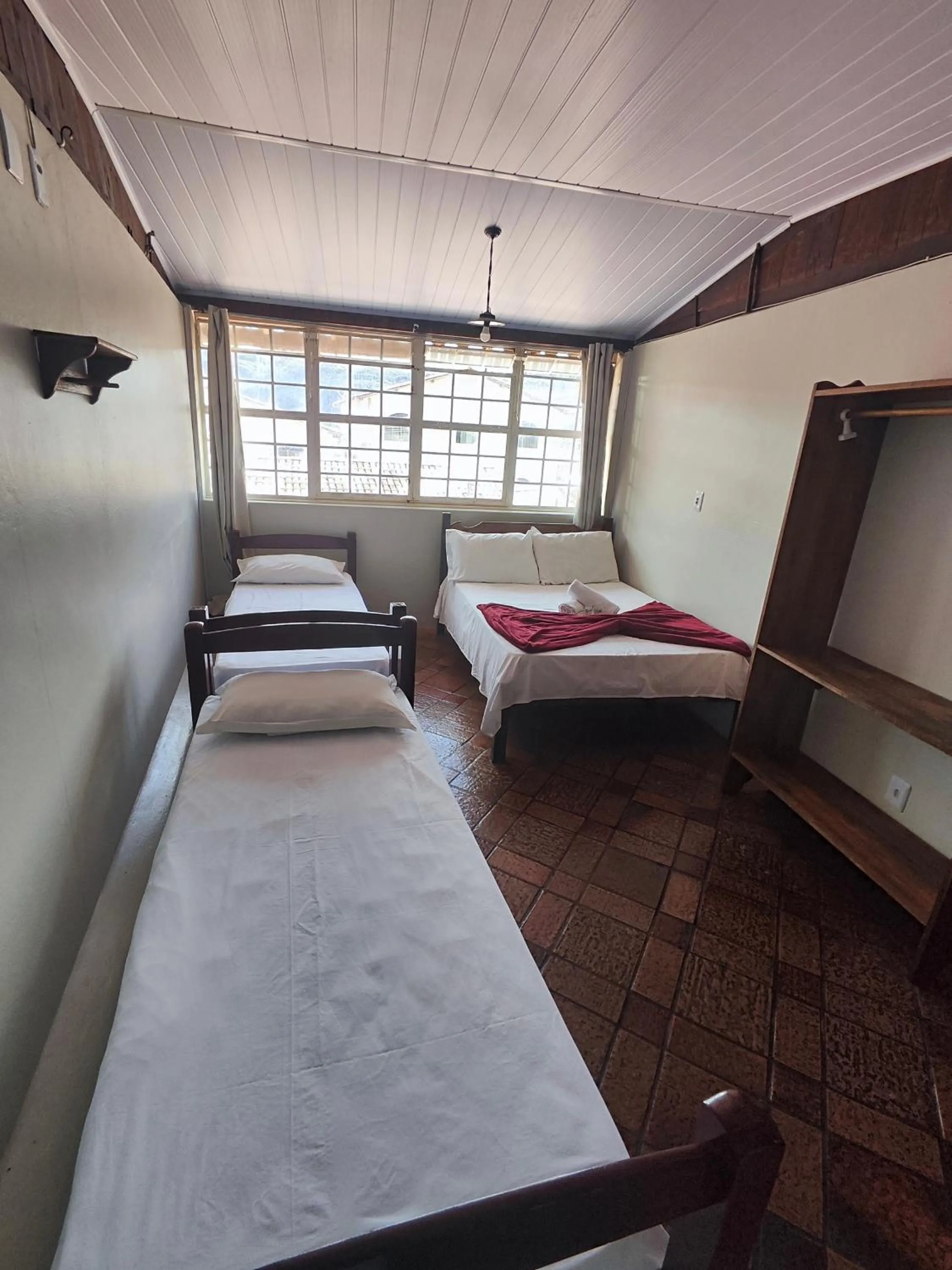 Bed in Pousada Acayaca