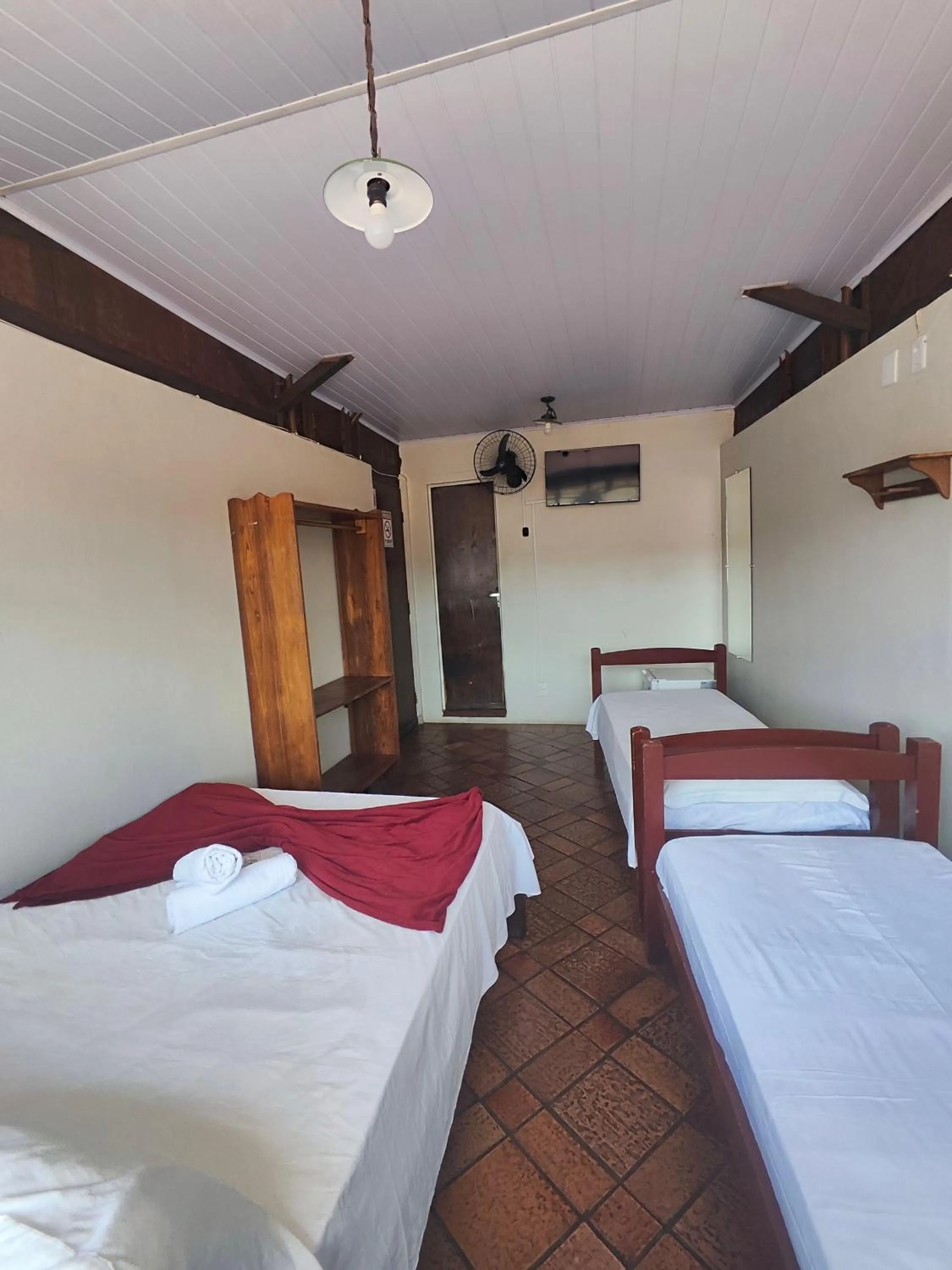 Bed in Pousada Acayaca