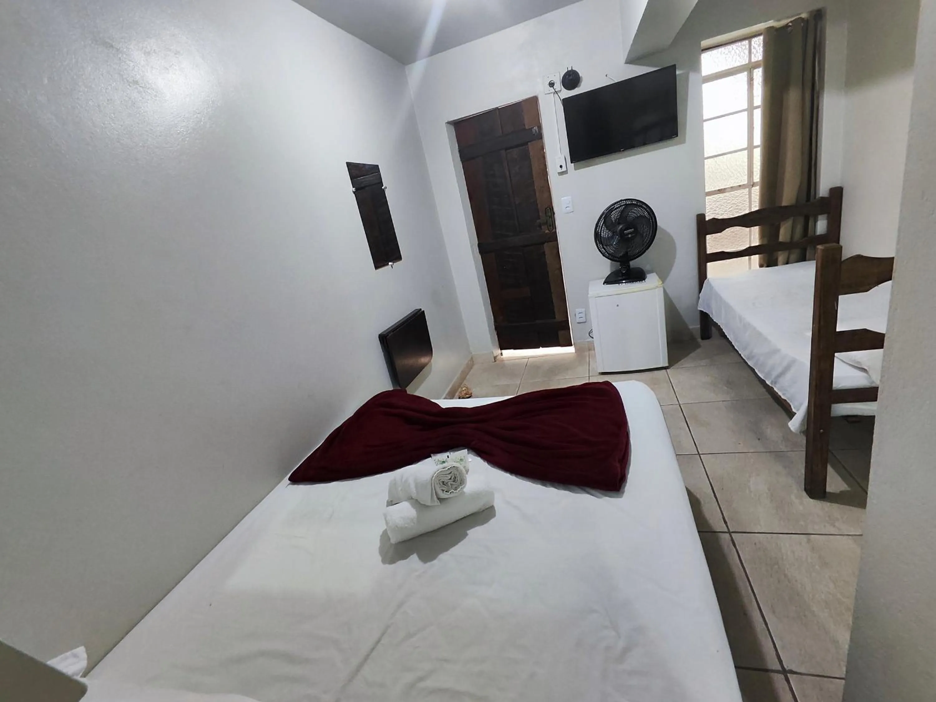 Bed in Pousada Acayaca