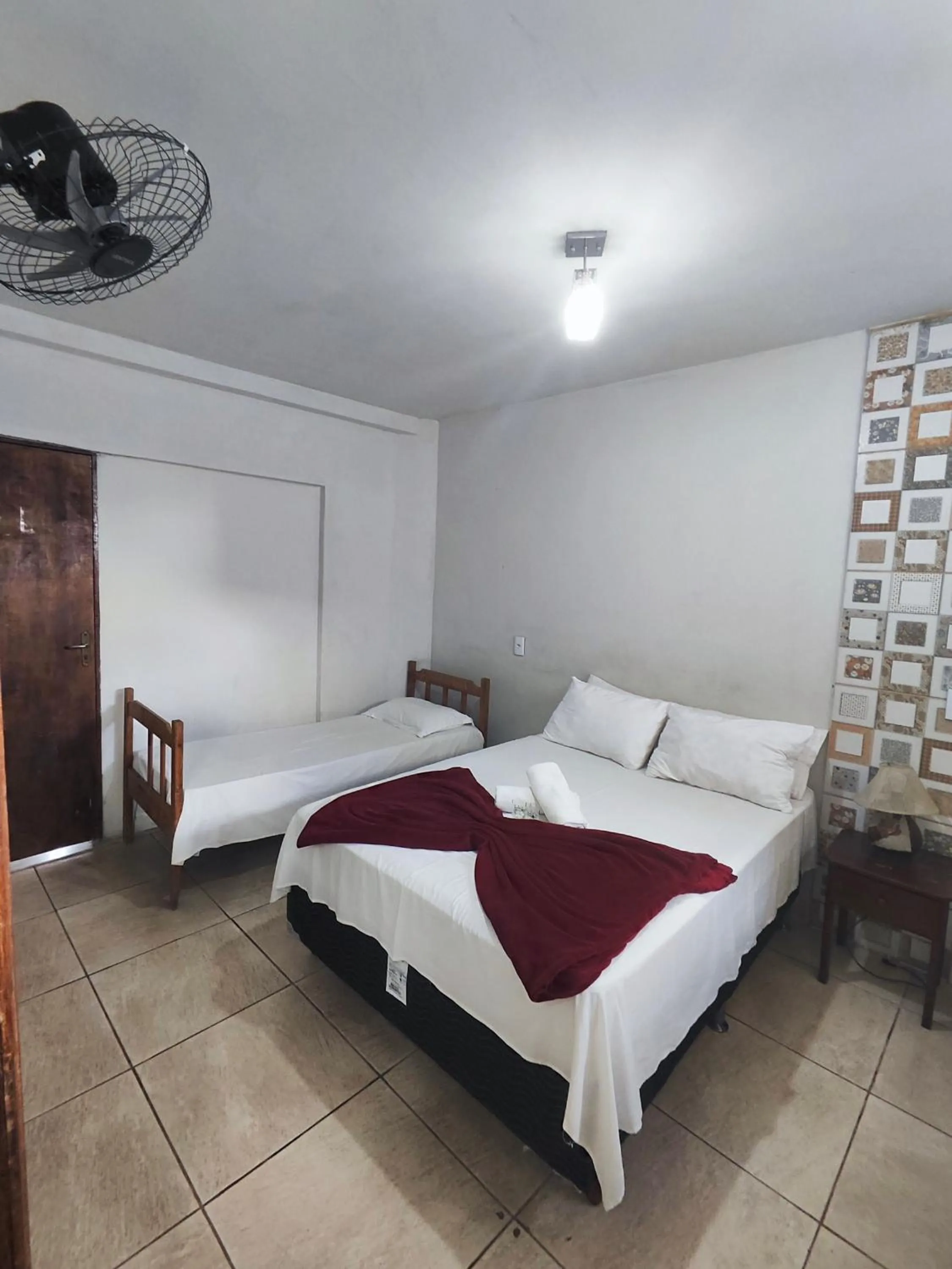 Bed in Pousada Acayaca