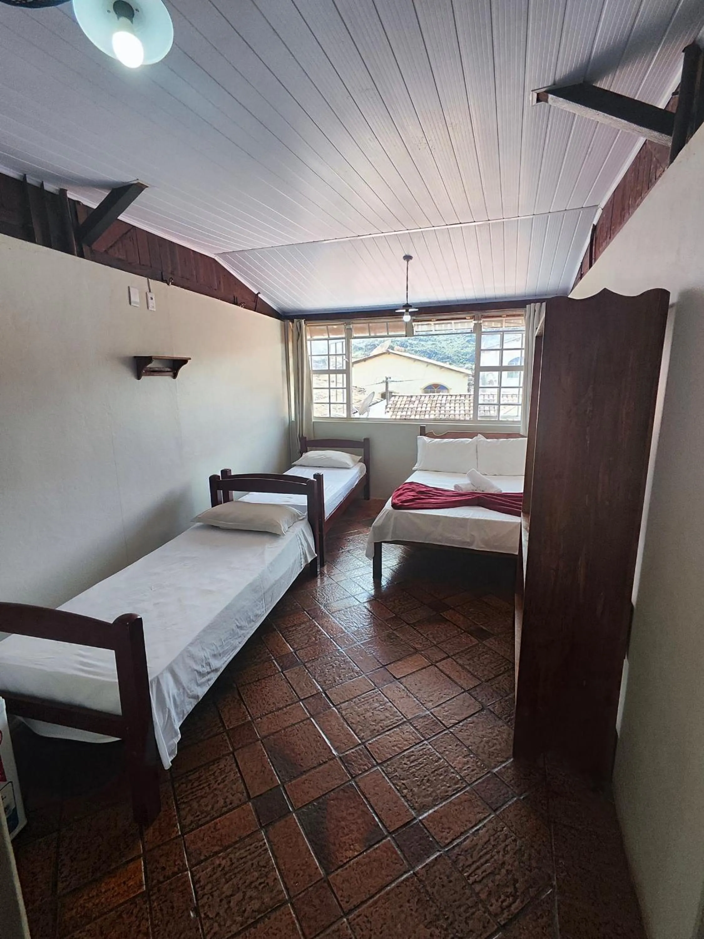 Bed in Pousada Acayaca