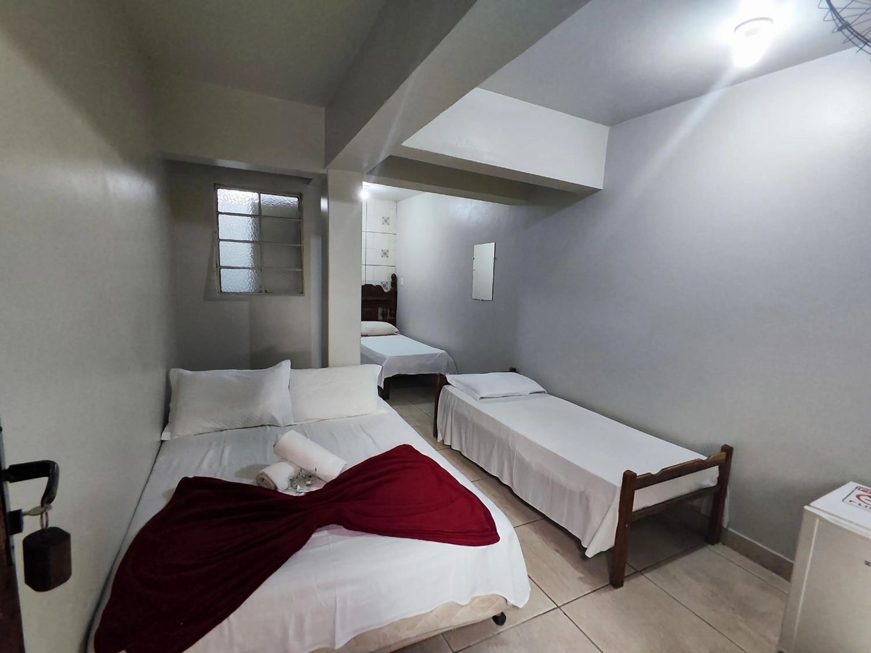 Bed in Pousada Acayaca