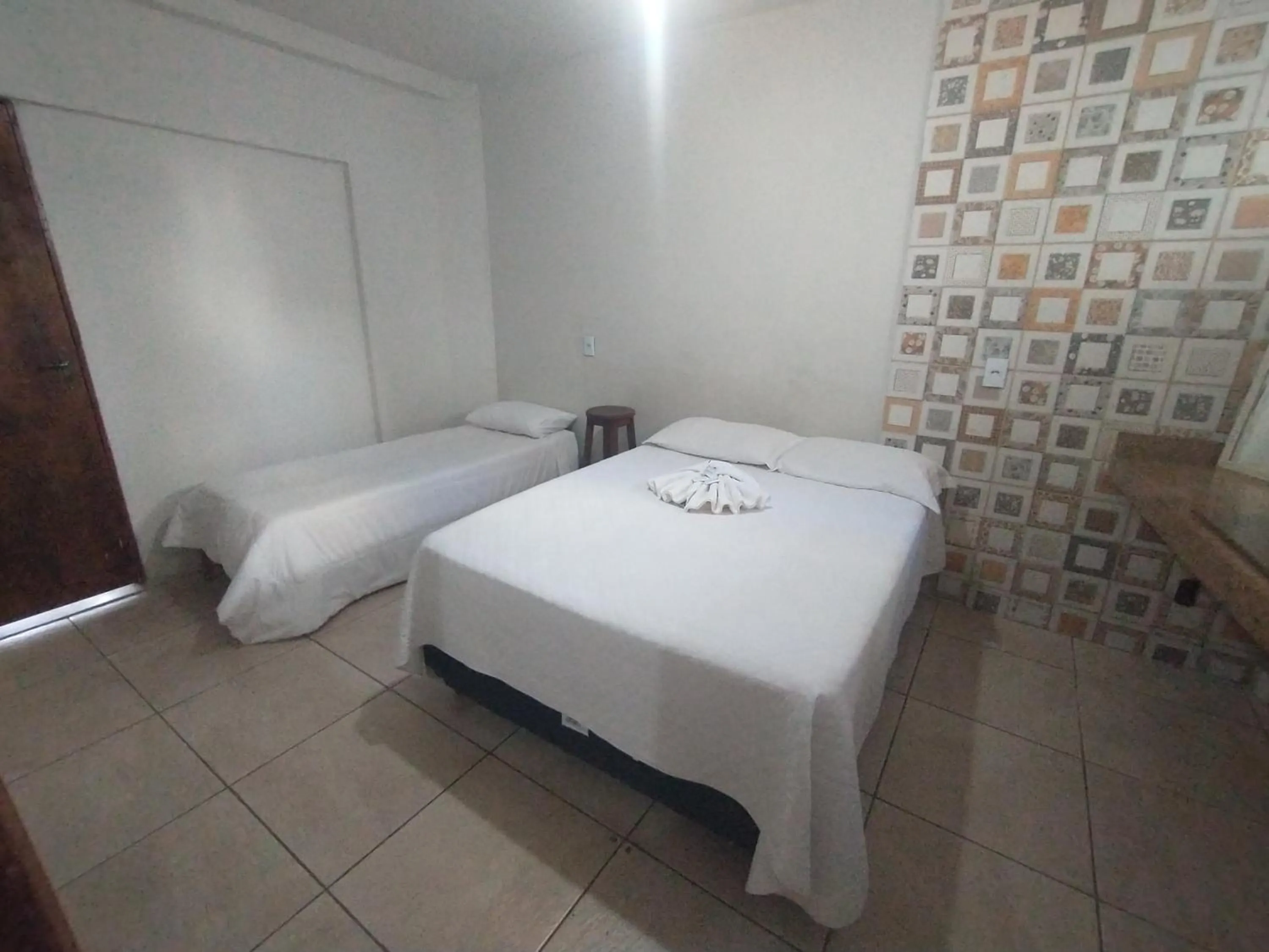 Bed in Pousada Acayaca