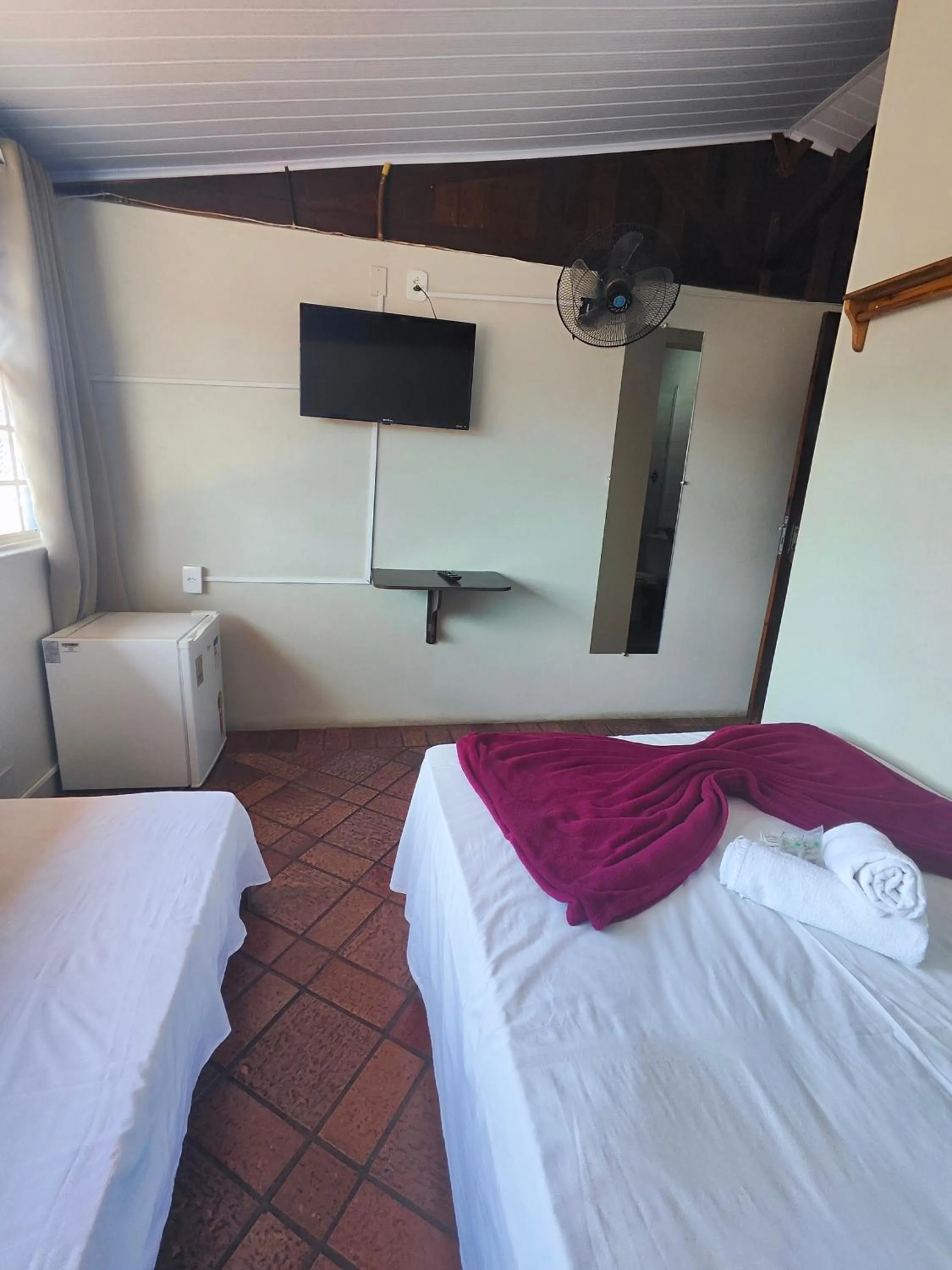 Bed in Pousada Acayaca