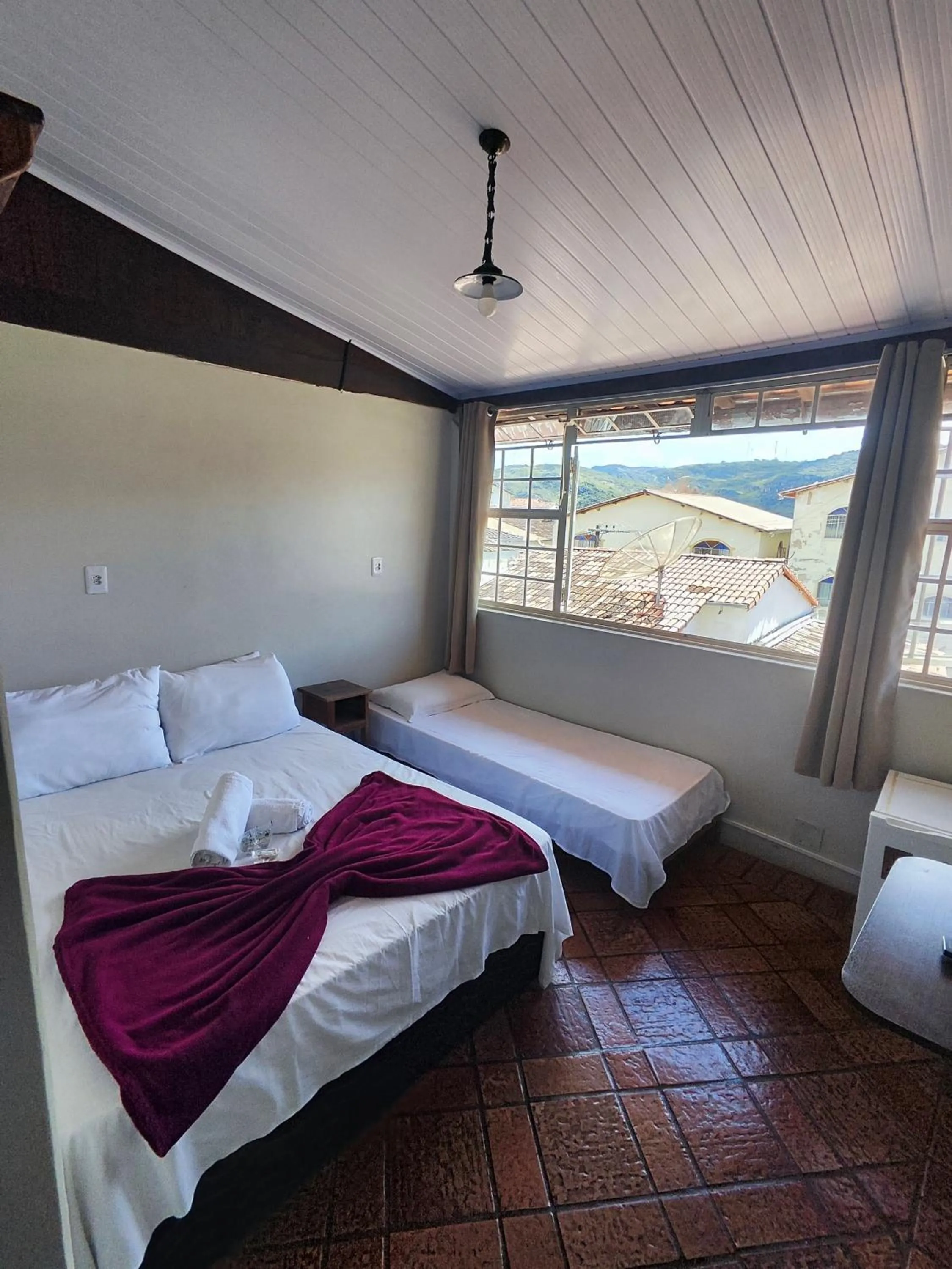 Bed in Pousada Acayaca