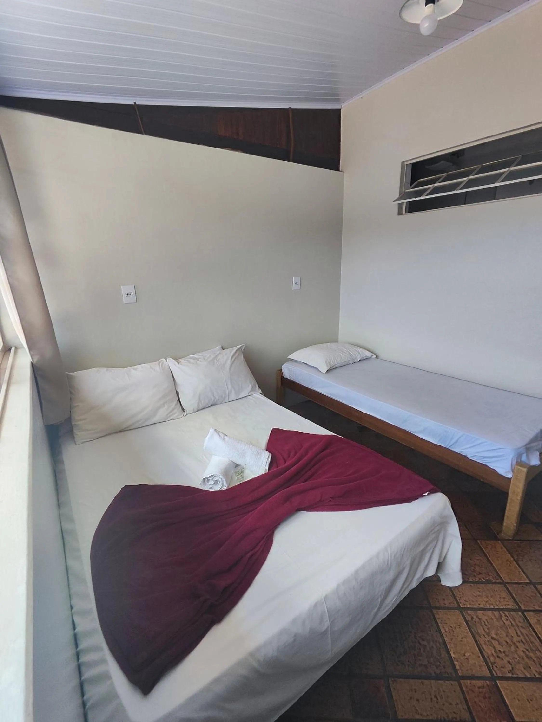 Bed in Pousada Acayaca