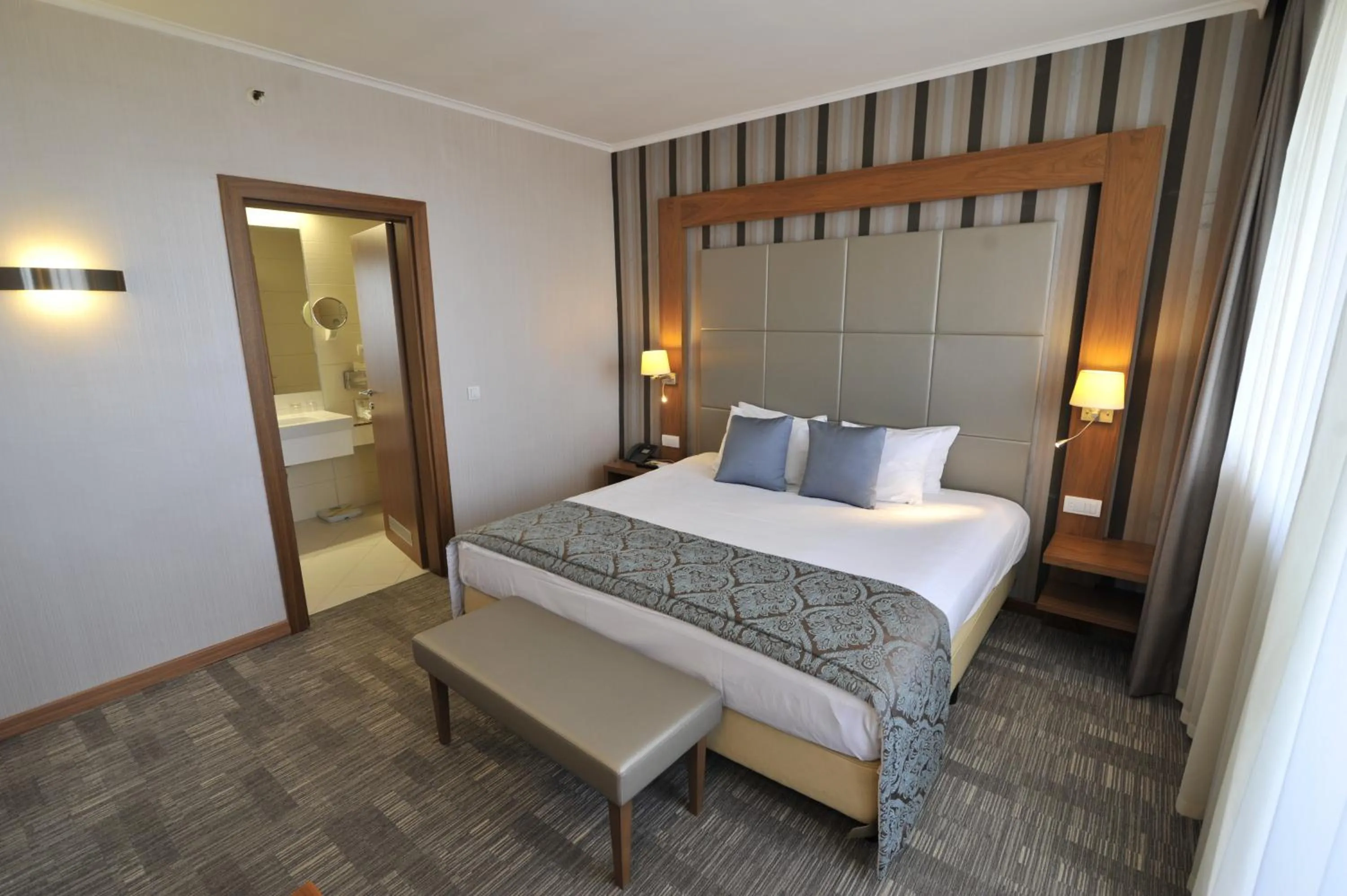 Photo of the whole room, Bed in Holiday Inn Skopje by IHG