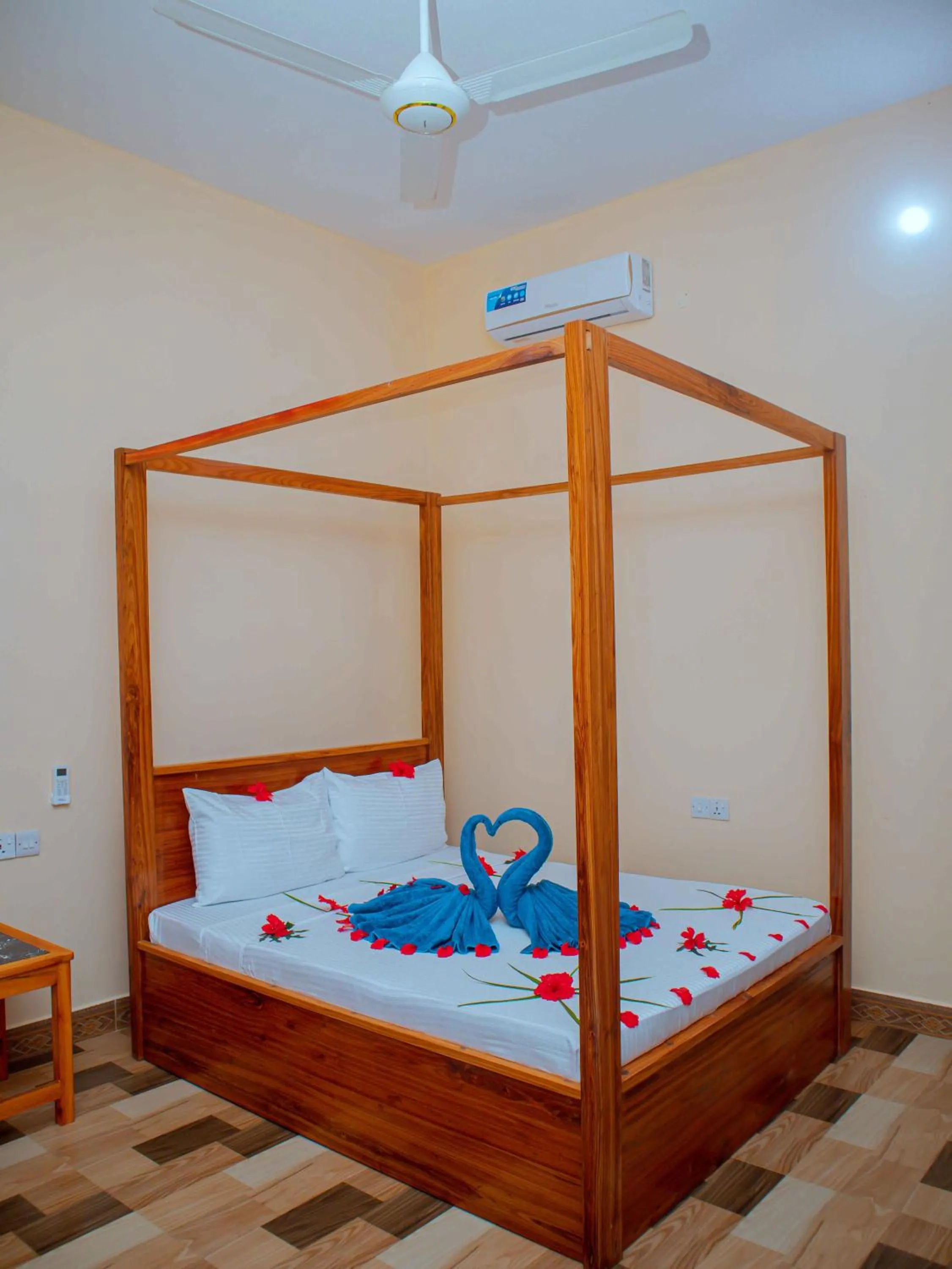 Bed in Tumaini Bungalows