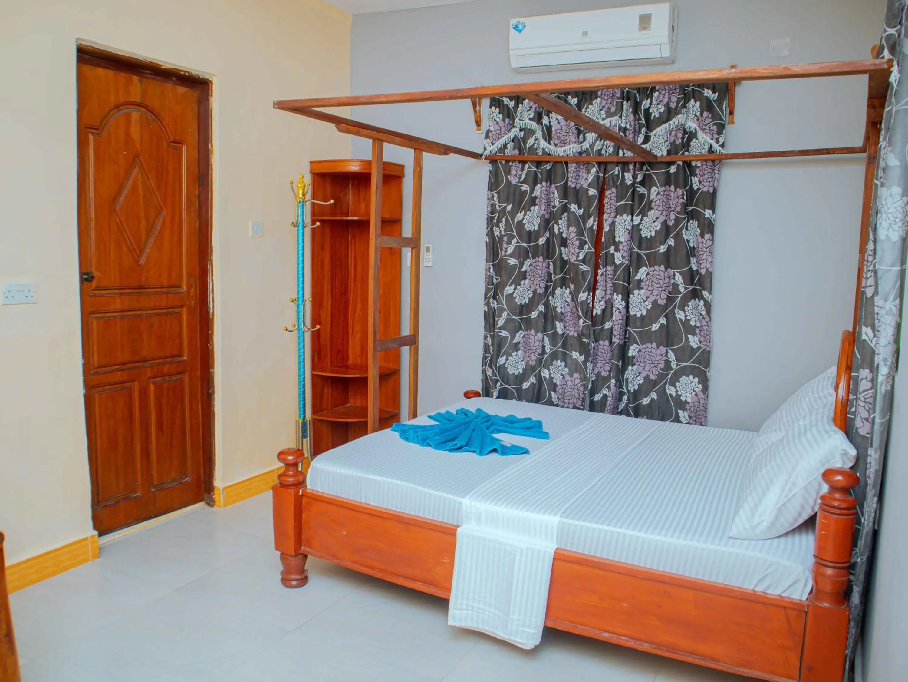 Bed in Tumaini Bungalows