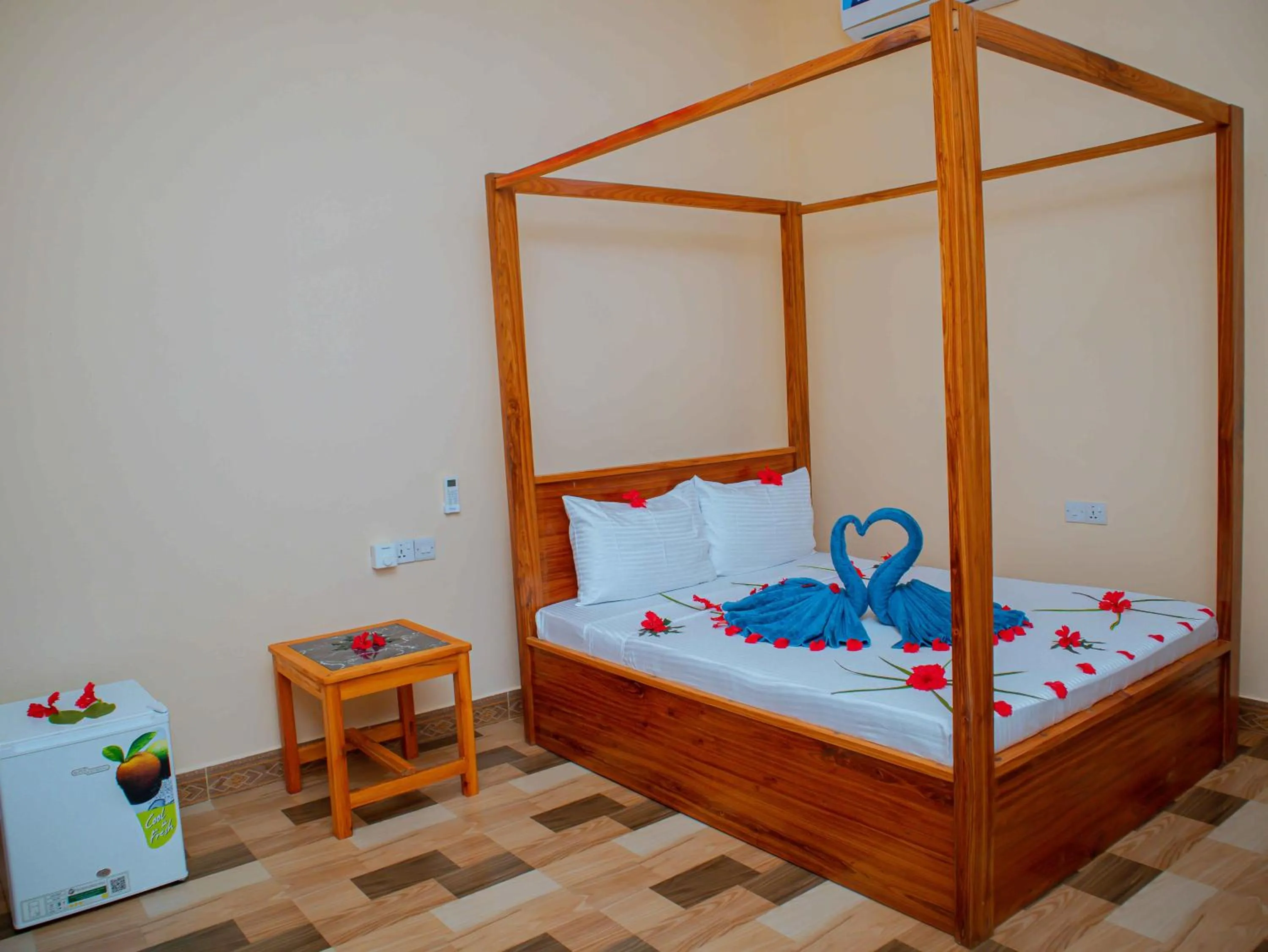 Bed in Tumaini Bungalows