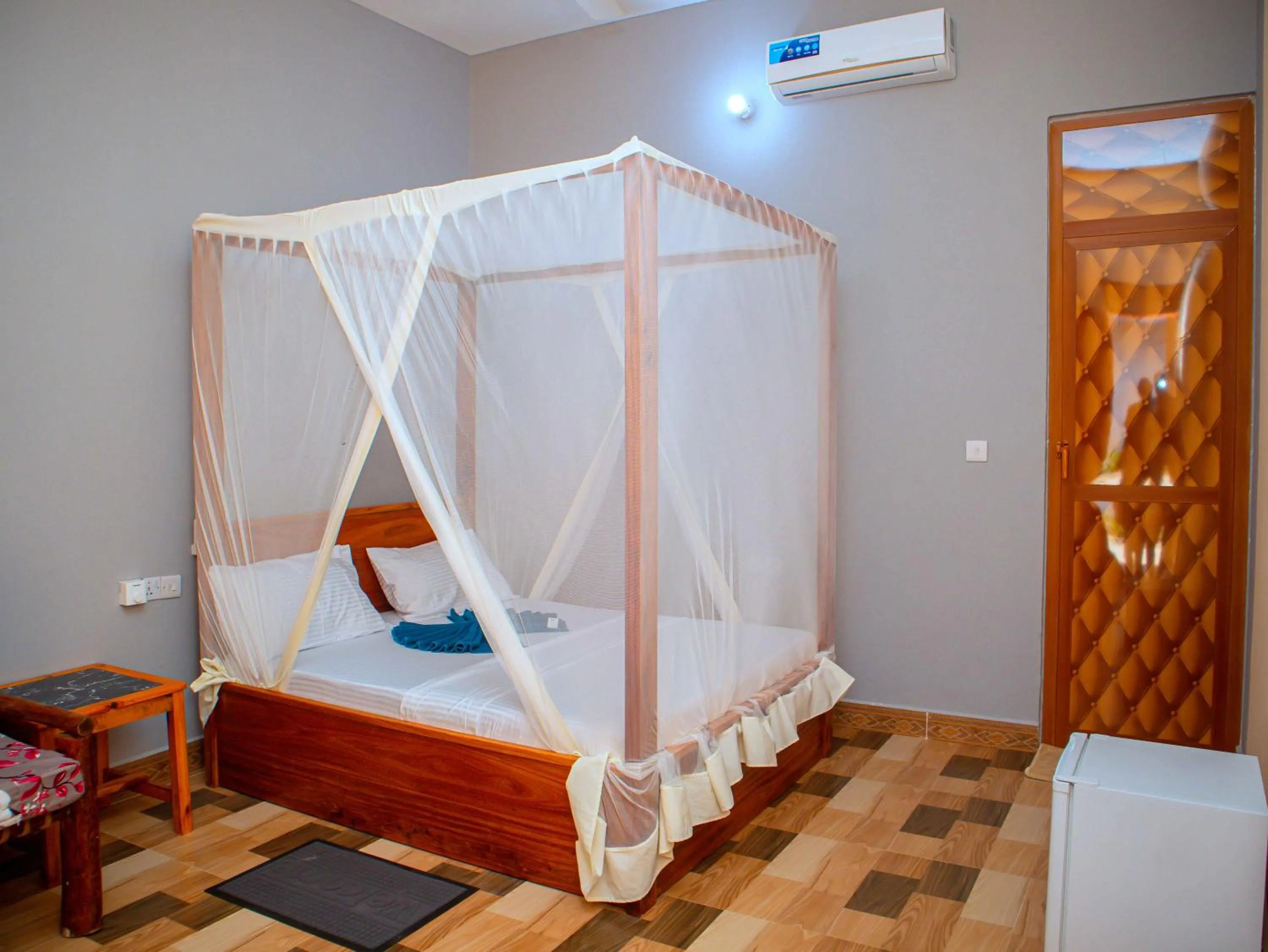 Bed in Tumaini Bungalows