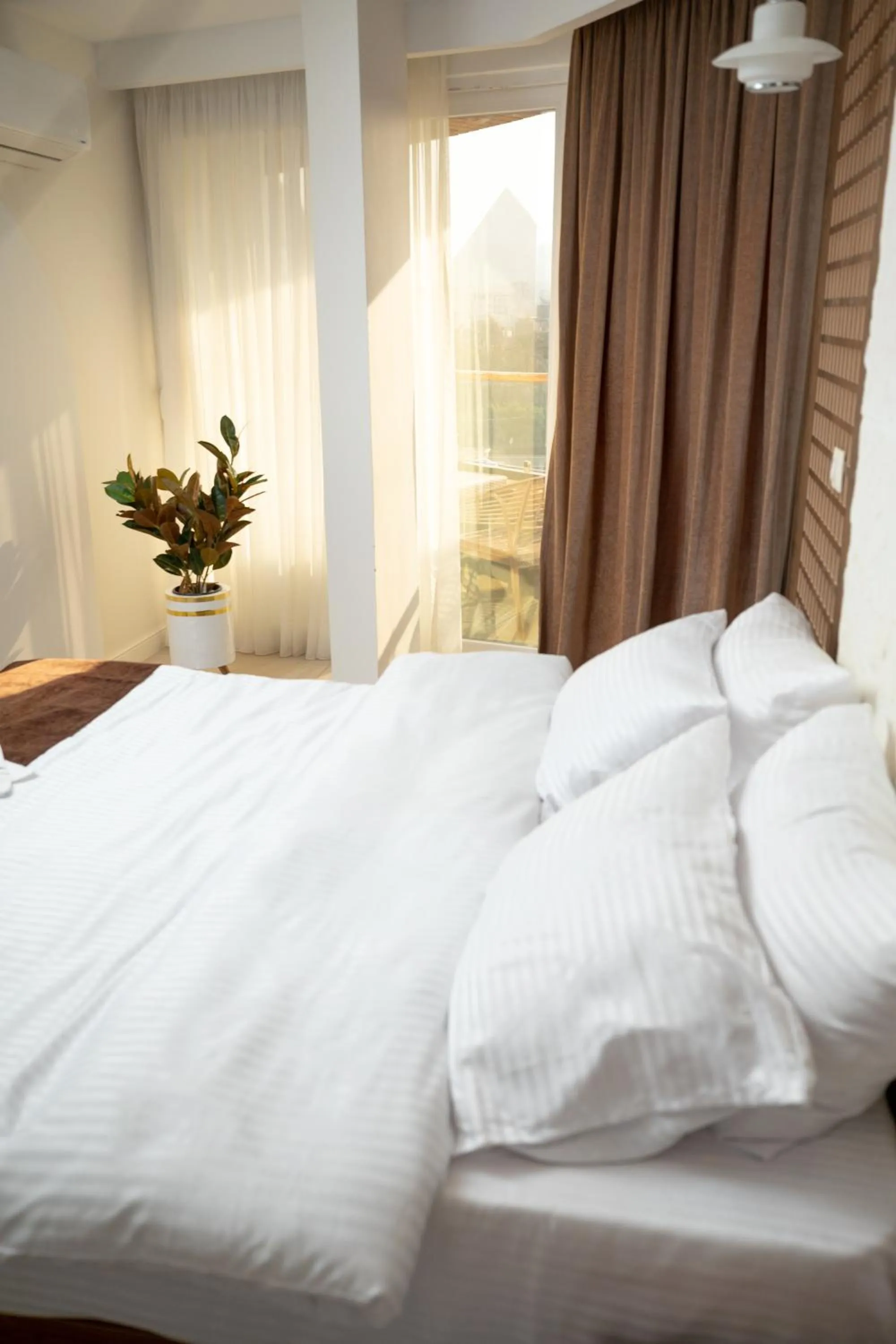 Bed in Eyes Of Egypt Pyramids View Boutique Hotel