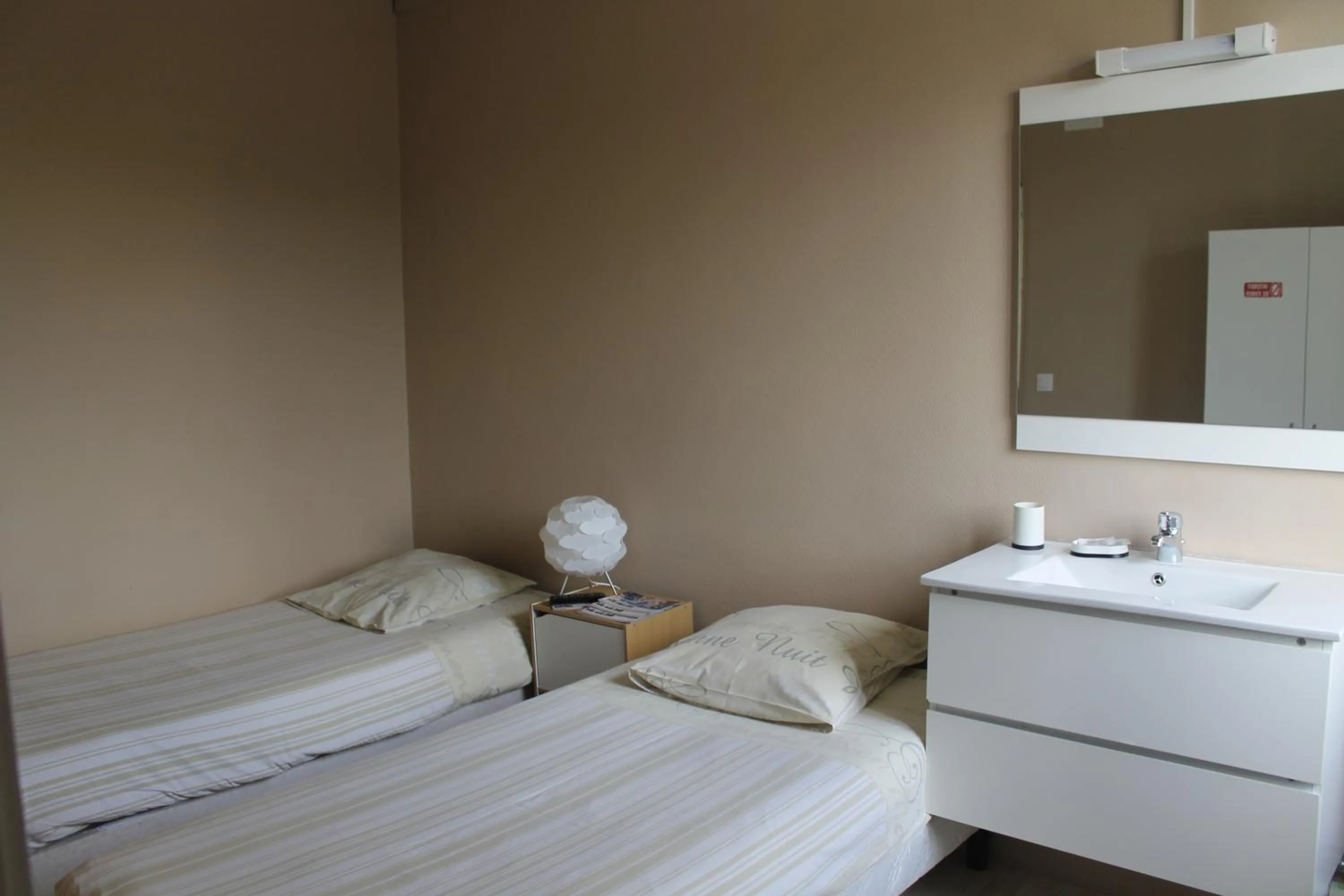 Bed in Le Bellevue Lisieux