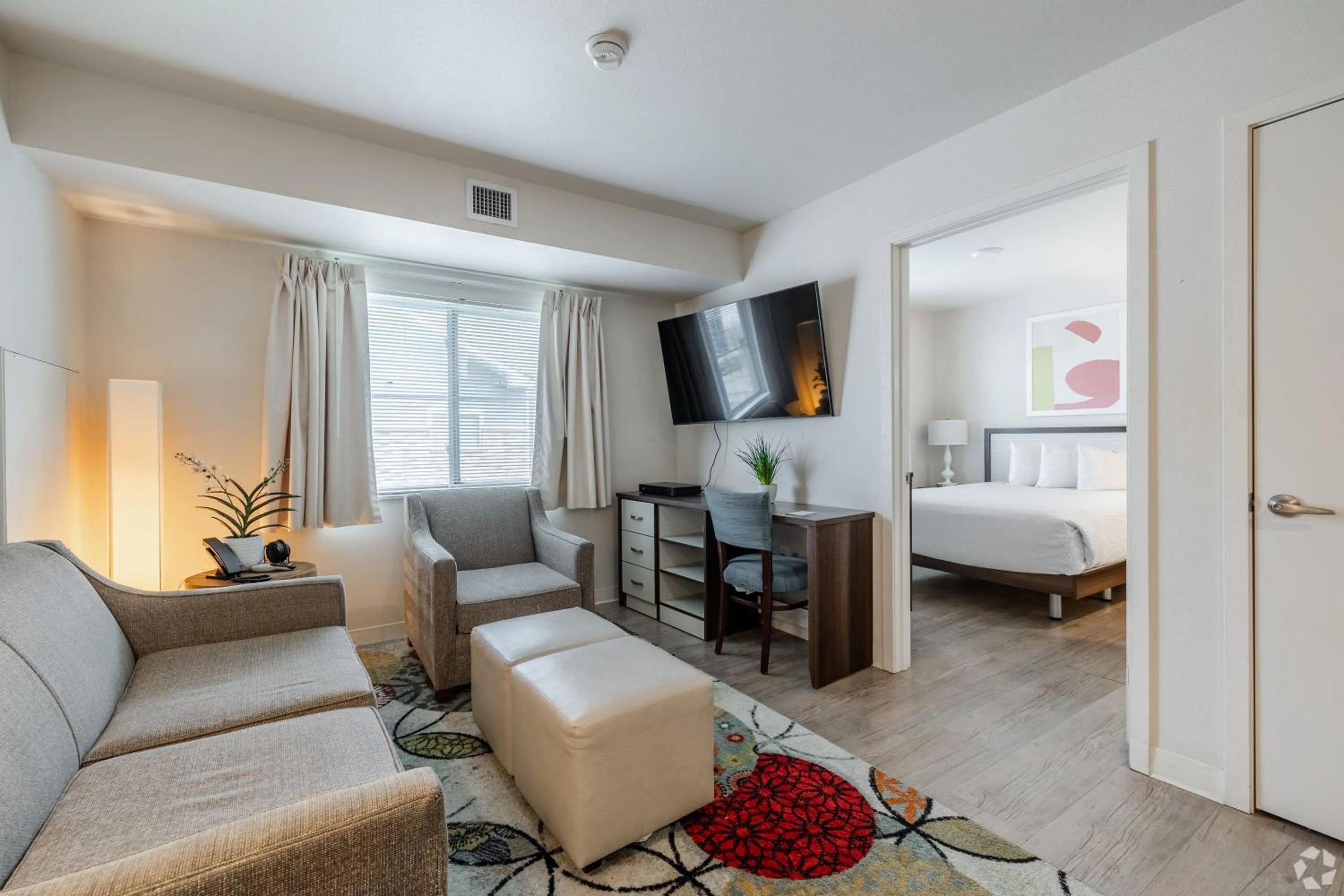 Living room, Bed in WaterWalk Extended Stay by Wyndham Wichita