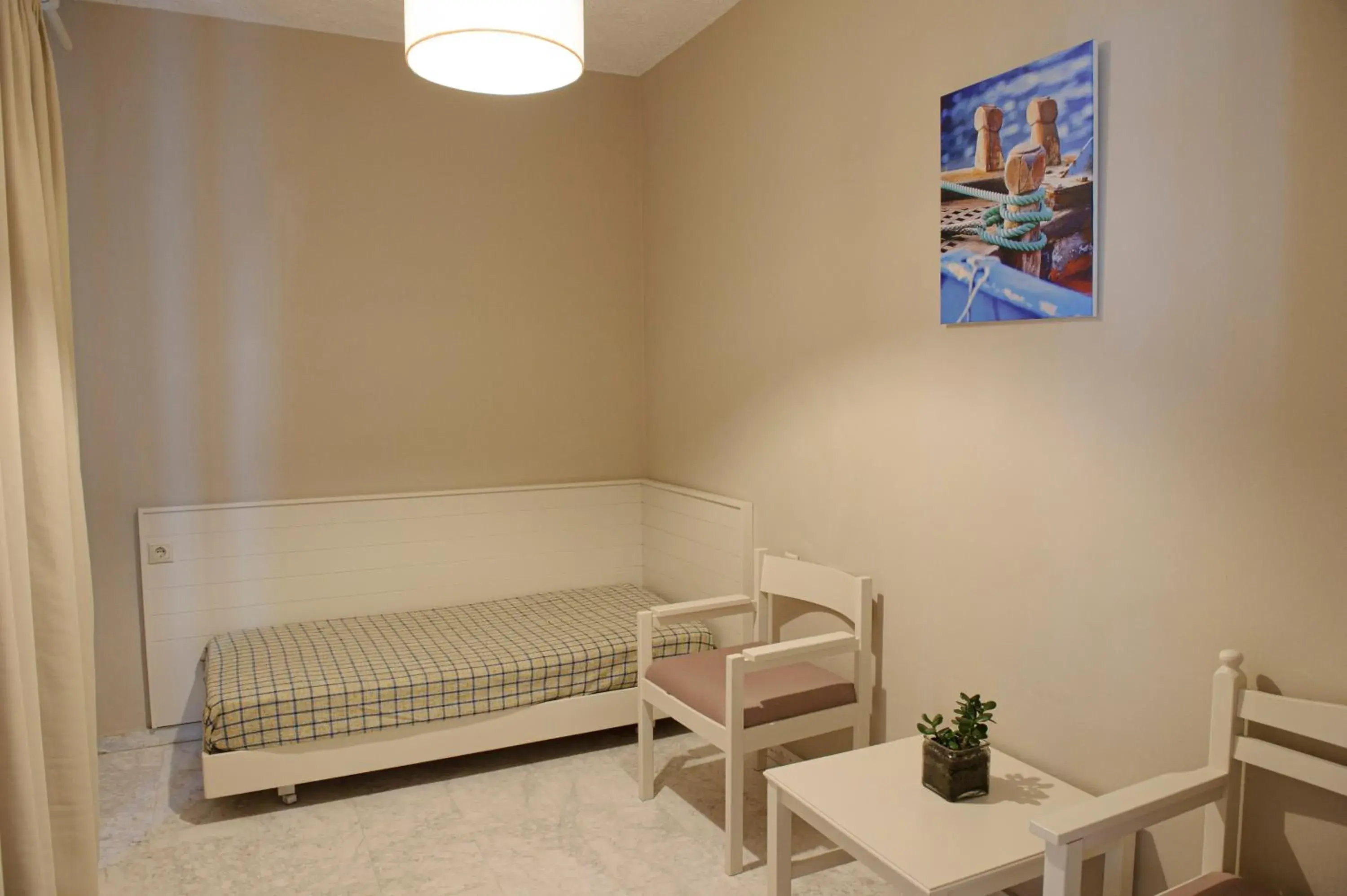 Seating area, Bed in Kalydna Island Hotel Seating area, Bed in Kalydna Island Hotel