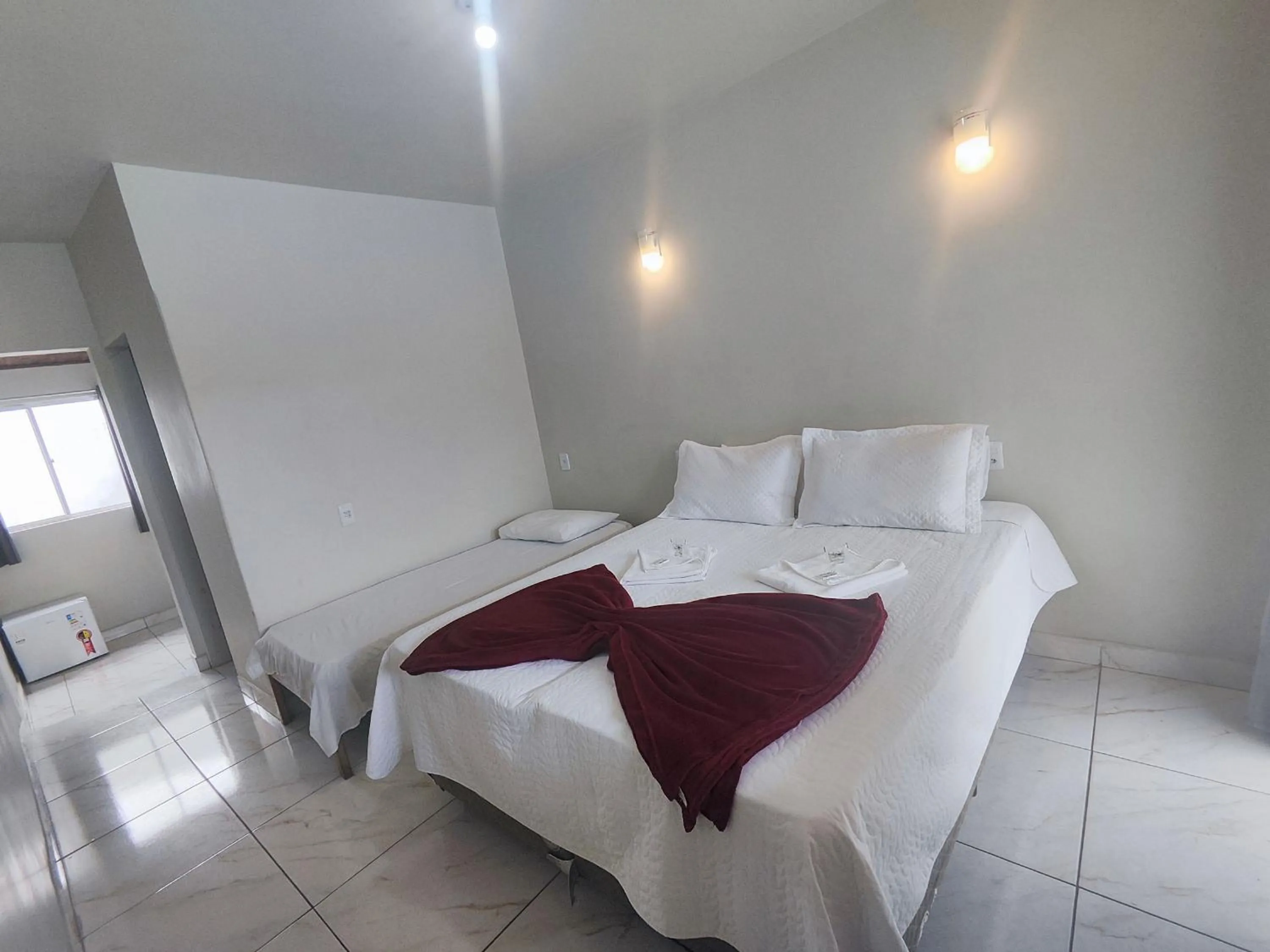 Bed in Pousada Sinhá Moça