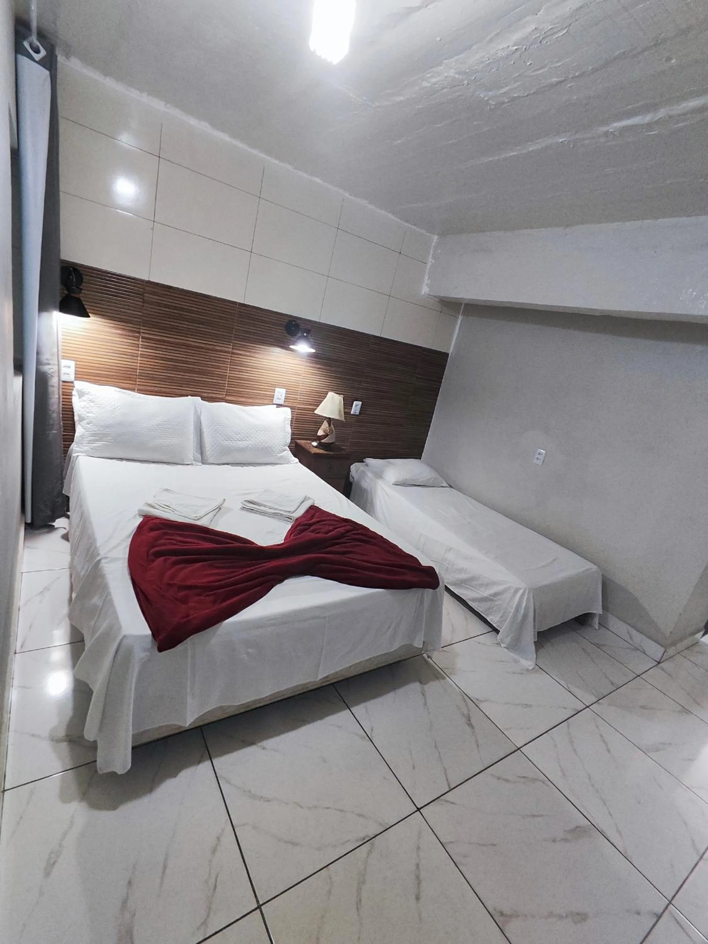 Bed in Pousada Sinhá Moça