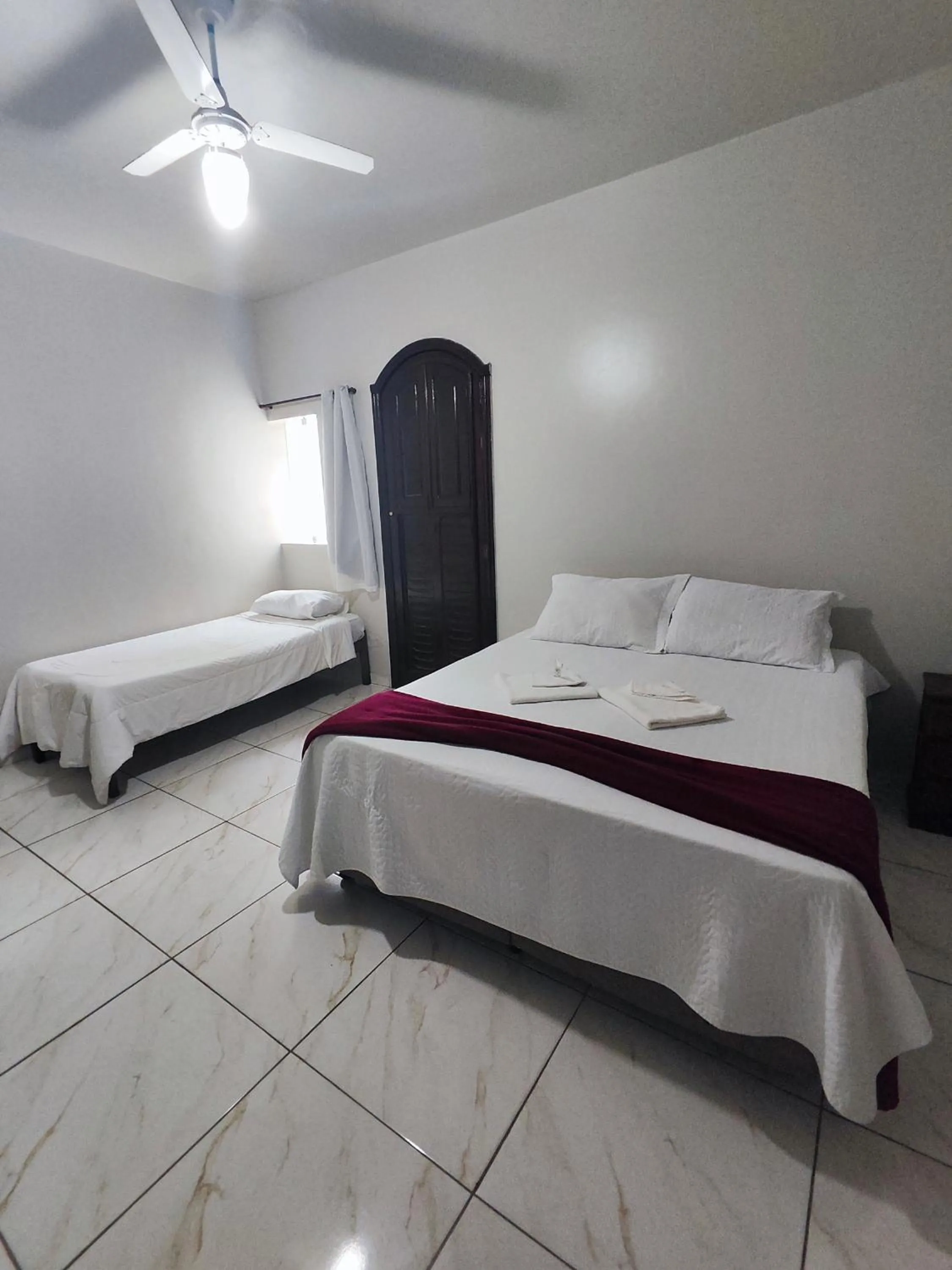 Bed in Pousada Sinhá Moça