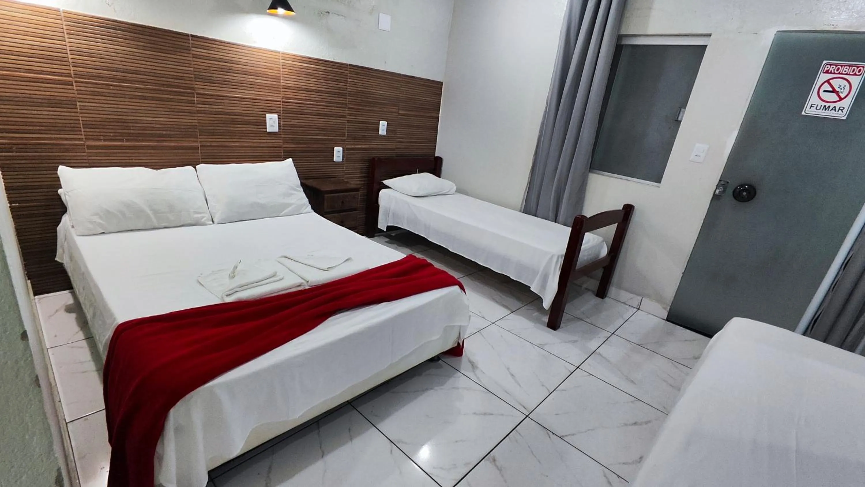 Bed in Pousada Sinhá Moça