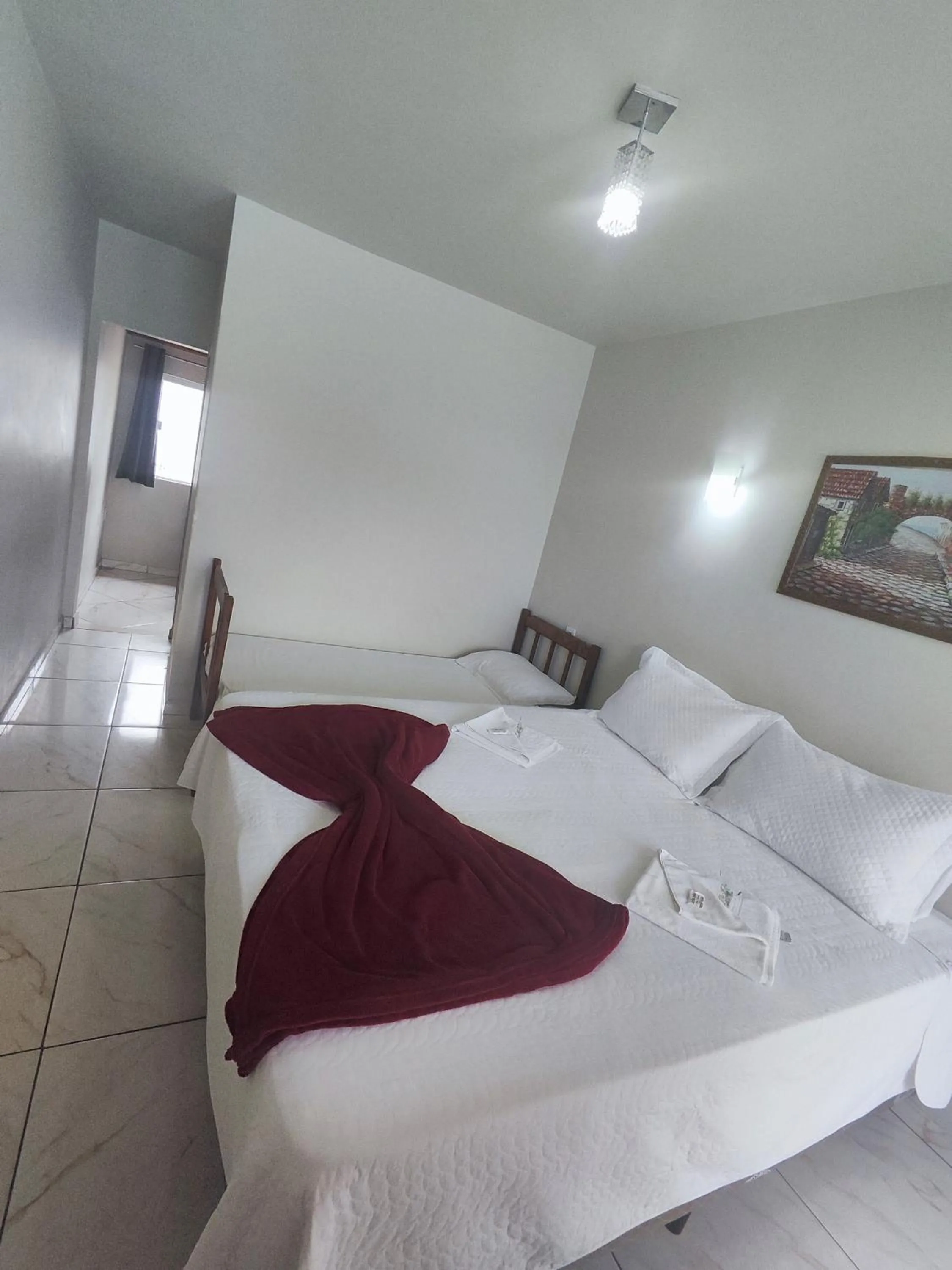 Bed in Pousada Sinhá Moça