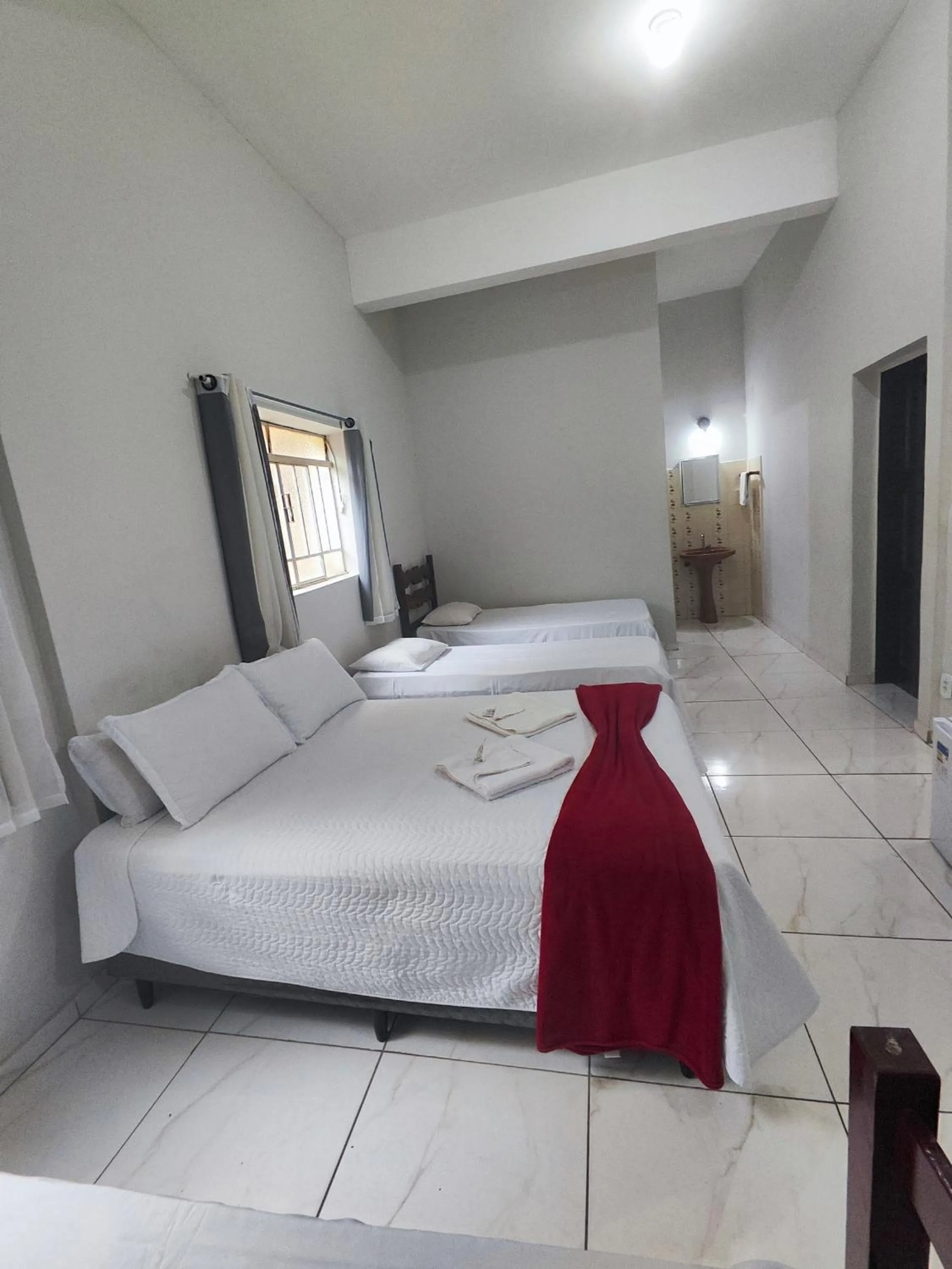 Bed in Pousada Sinhá Moça